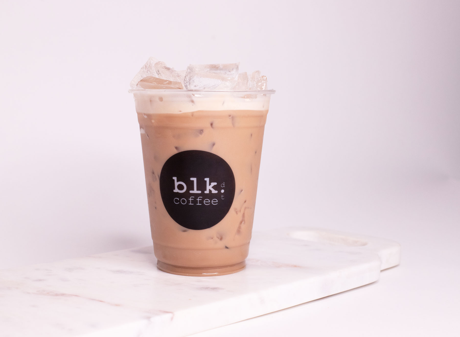 Order Iced Oolong Milk Tea food online from Blk Dot Coffee store, Irvine on bringmethat.com