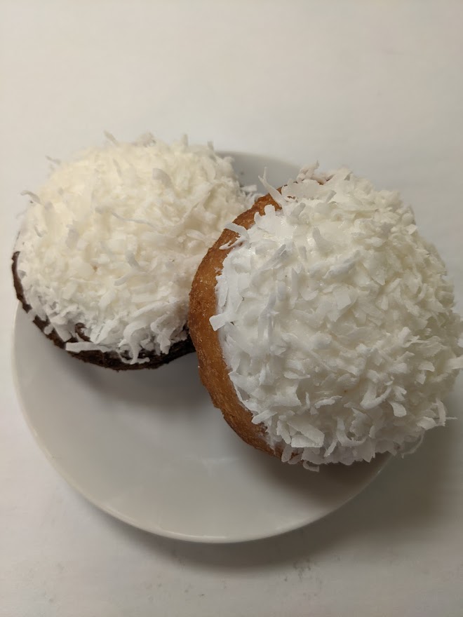 Order Yellow Cake Donut with Yummy Whip Topping and Coconut food online from Morkes Chocolate store, Huntley on bringmethat.com