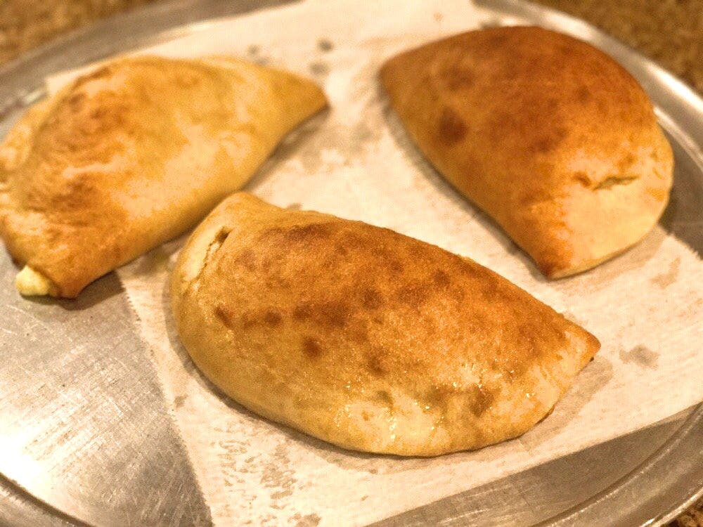 Order Calzone - Calzone food online from Marc's Deli & Pizzeria store, Park Ridge on bringmethat.com
