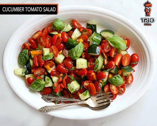 Order Cucumber tomato salad food online from Trio Grill store, Anaheim on bringmethat.com