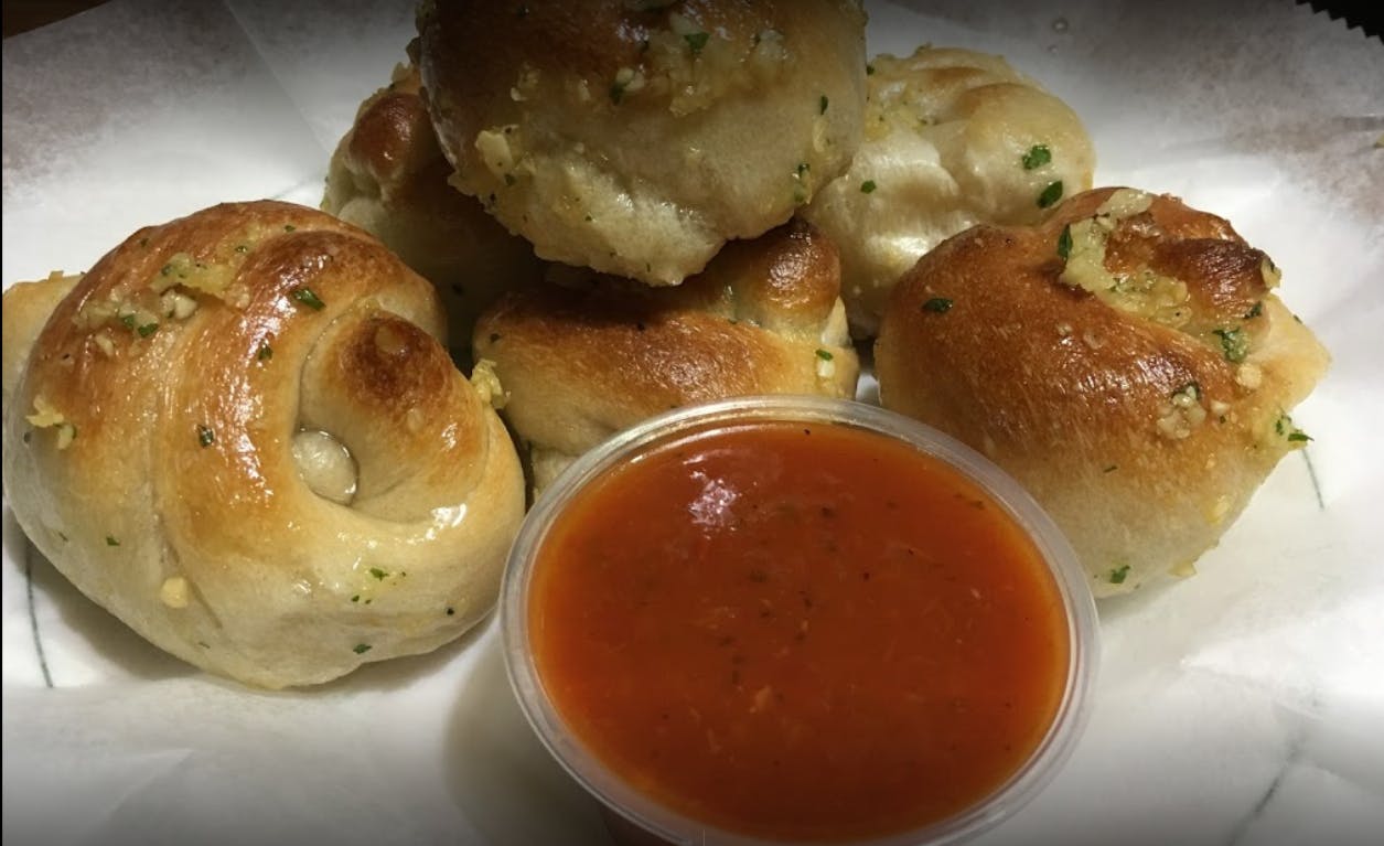 Order Garlic Knots - 6 Pieces food online from Gabriella's Family Pizza store, Flushing on bringmethat.com