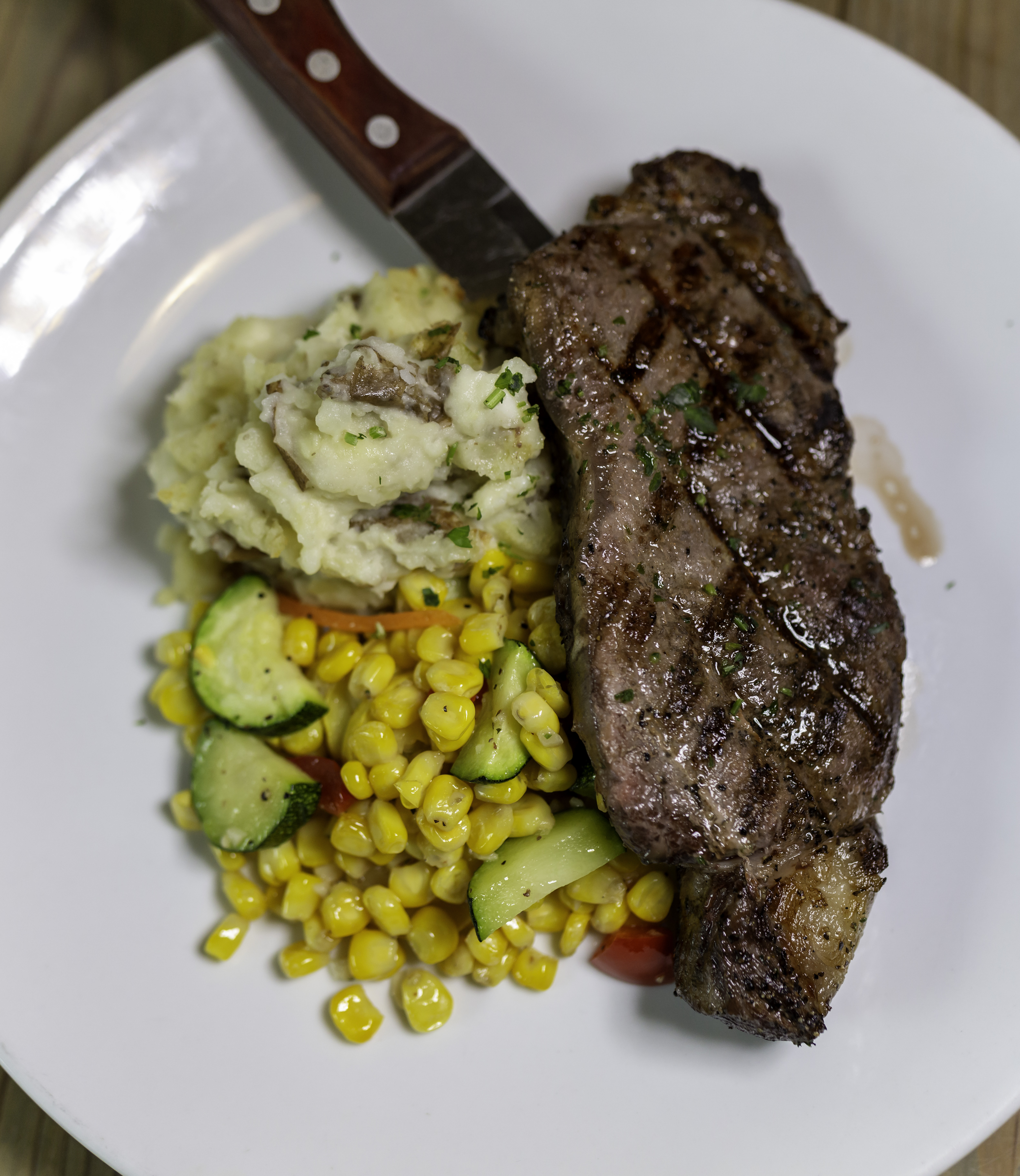 Order 12 Ounce NY Strip Steak with Mashed Potato & Veggies food online from North Sea Tavern store, Southampton on bringmethat.com