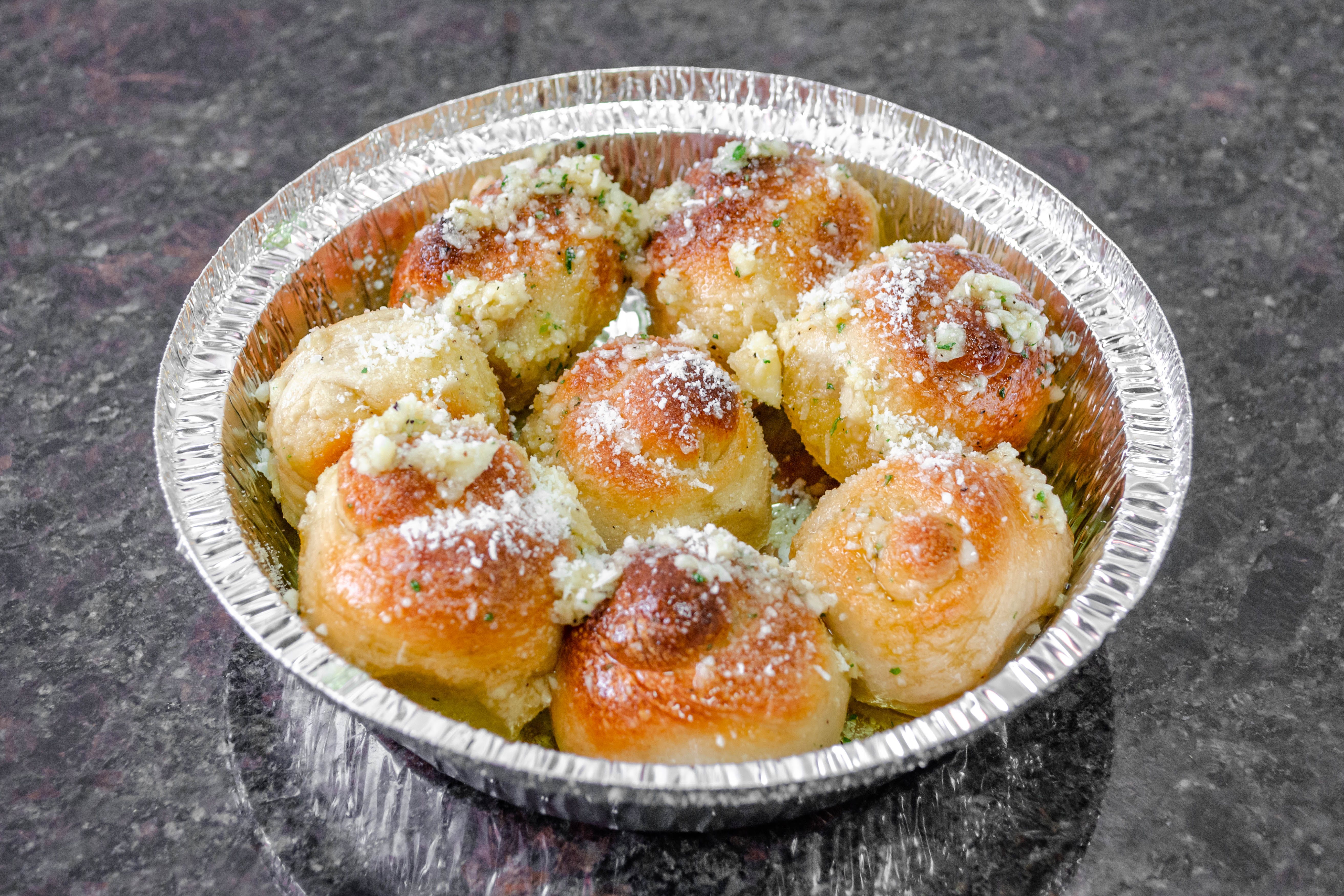 Order Garlic Knots - 5 Pieces food online from Justino's Pizza store, New York on bringmethat.com