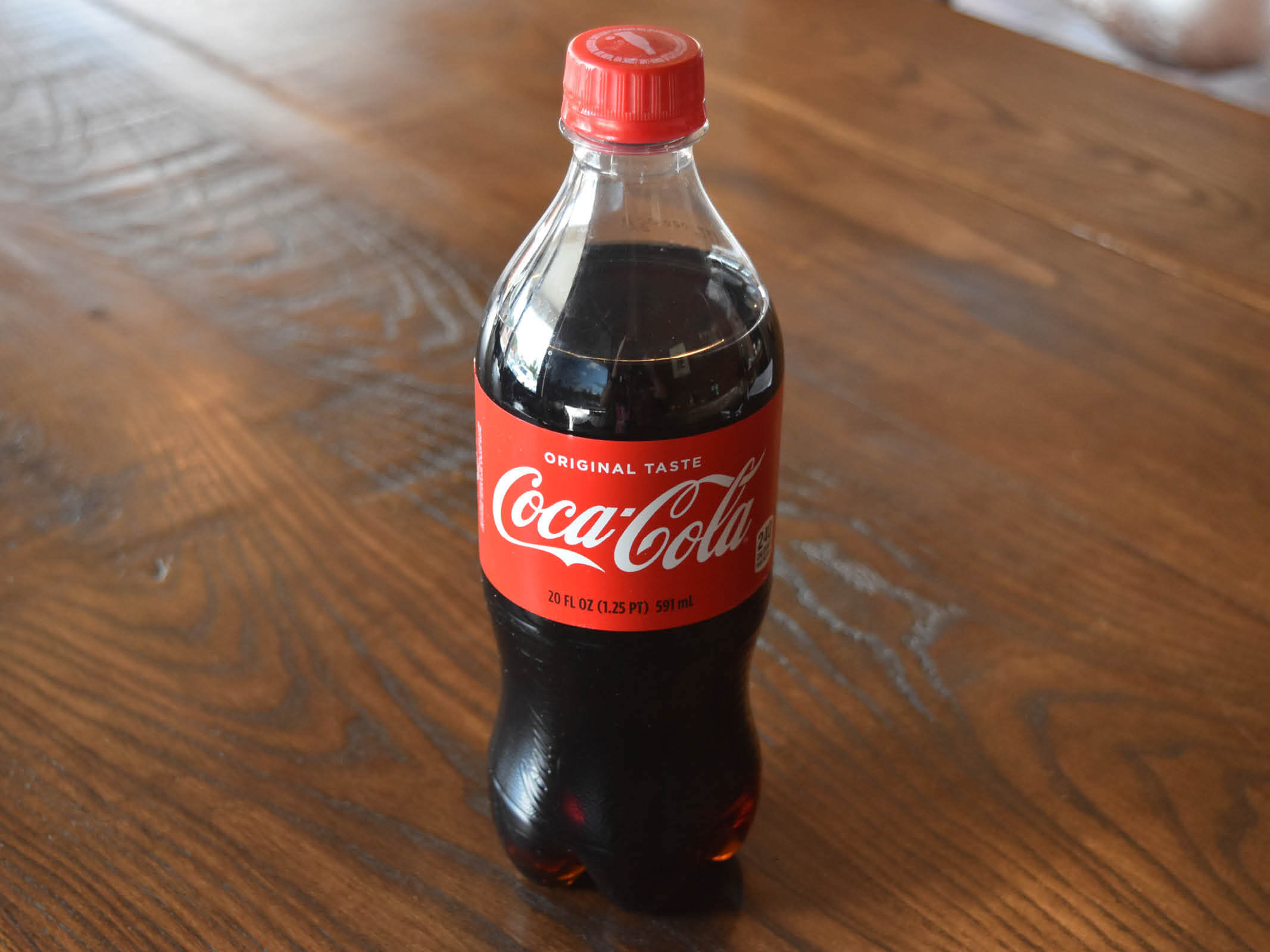Order 20 oz Coke food online from La Madeleine French Bakery & Cafe store, Dallas on bringmethat.com