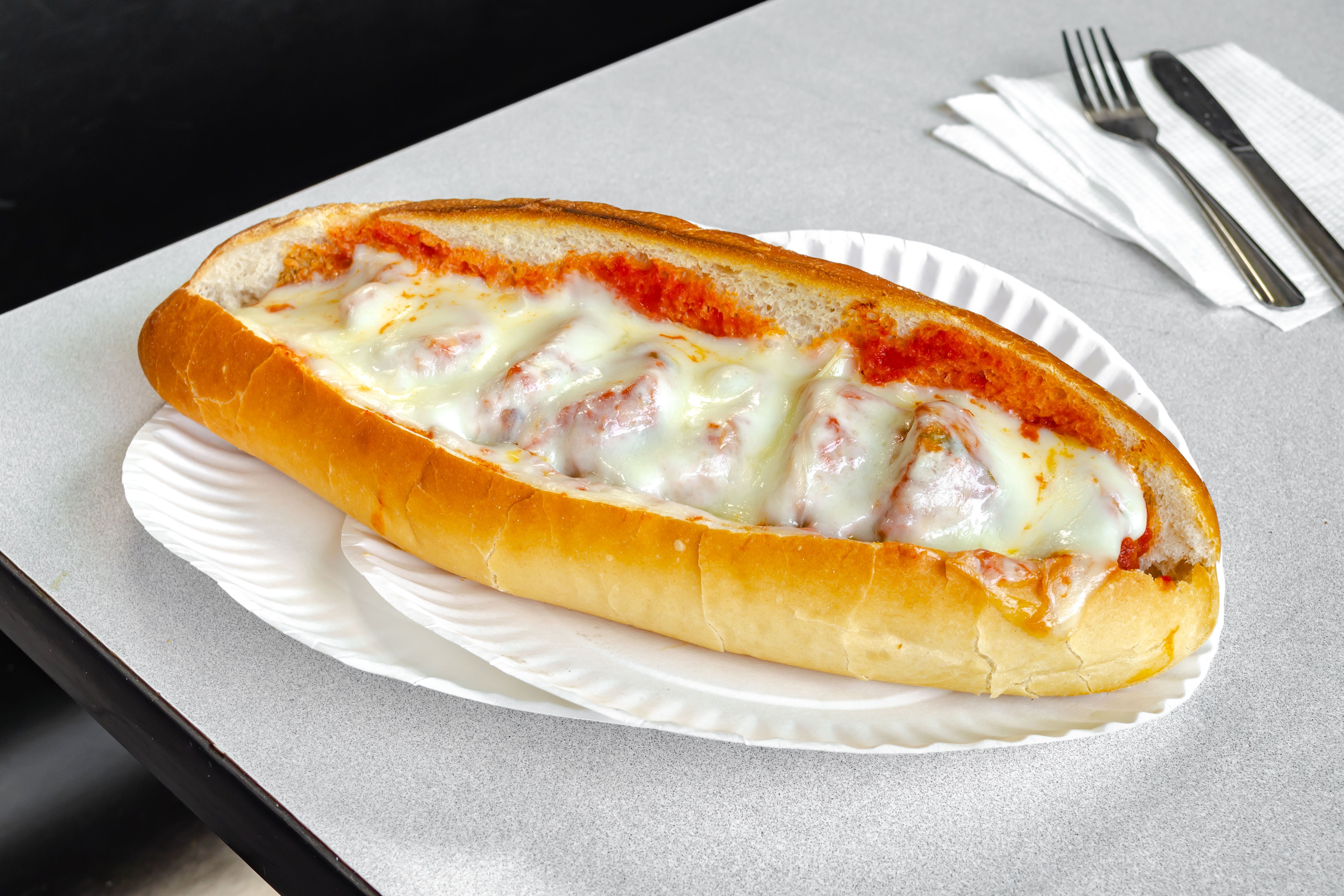 Order 15. Meatball Parm Sub - 10" food online from TJ's Pizza store, Asbury Park on bringmethat.com