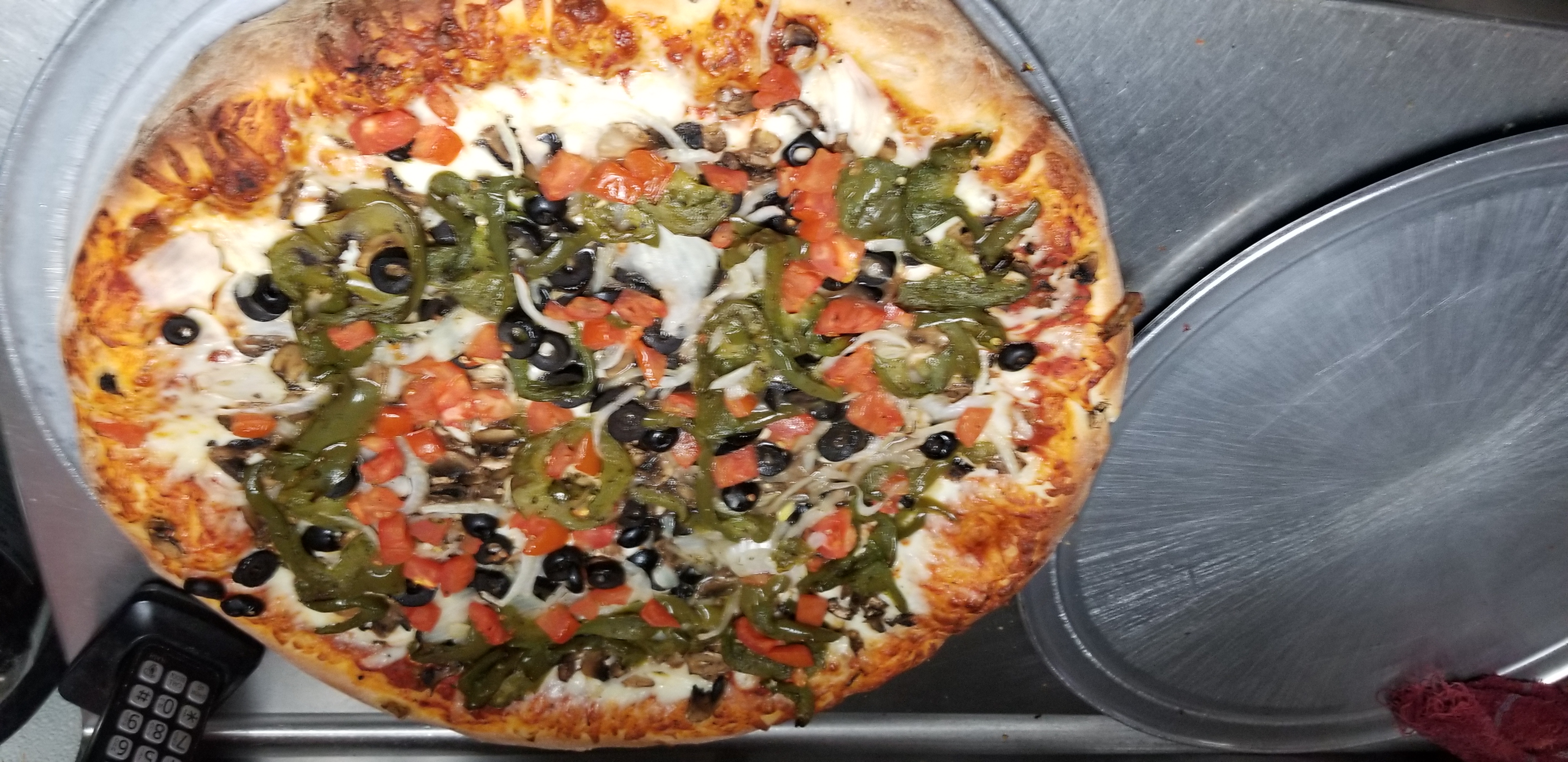 Order Vegetarian Pizza food online from Haus Of Pizza store, Palm Desert on bringmethat.com