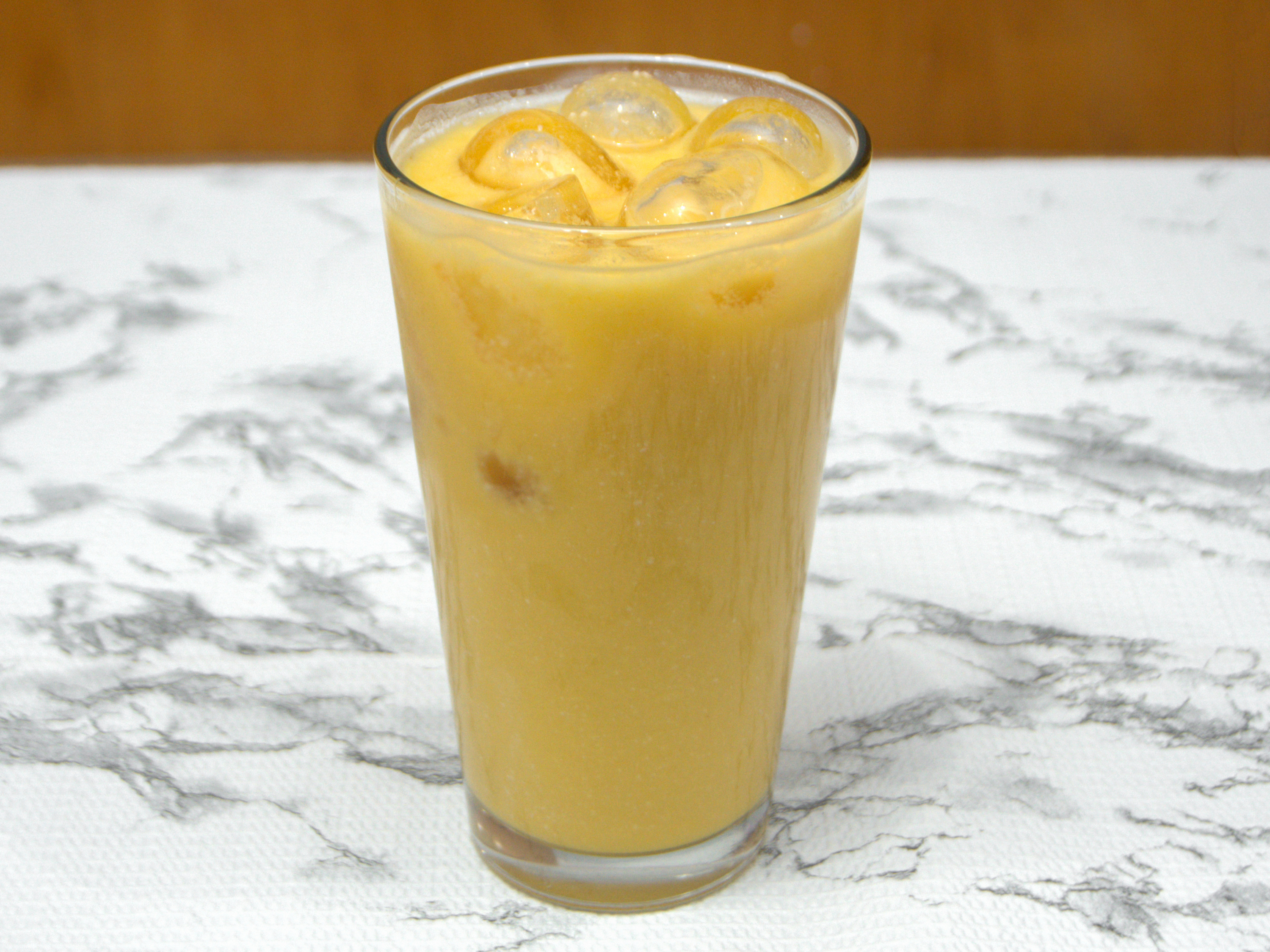 Order Mango Lassi food online from Small World Kitchen store, Detroit on bringmethat.com