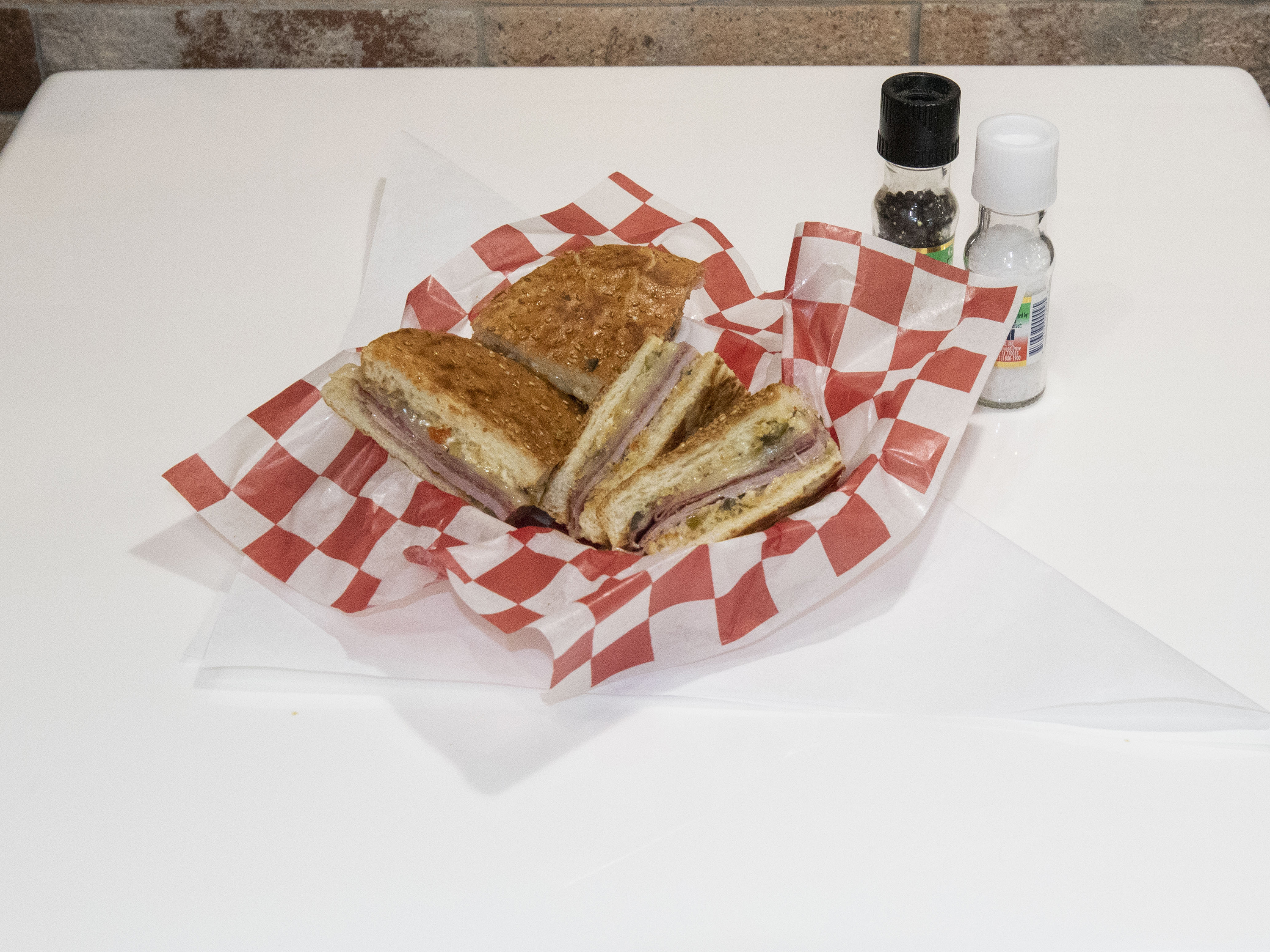 Order WHOLE MUFFALETTA food online from Paulies Poboys store, Houston on bringmethat.com