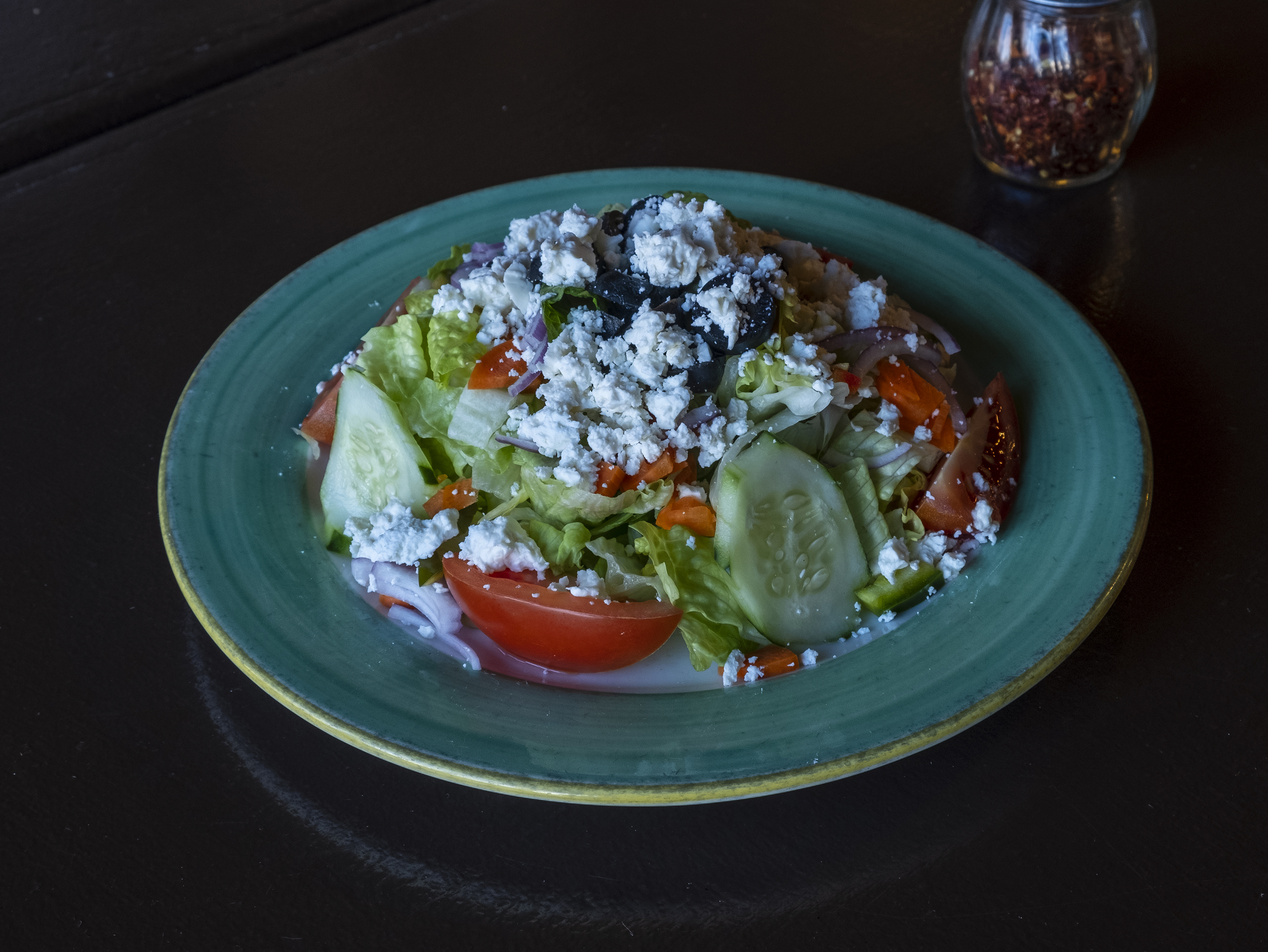 Order Greek Salad food online from Slices Pizzeria store, Hastings-on-Hudson on bringmethat.com