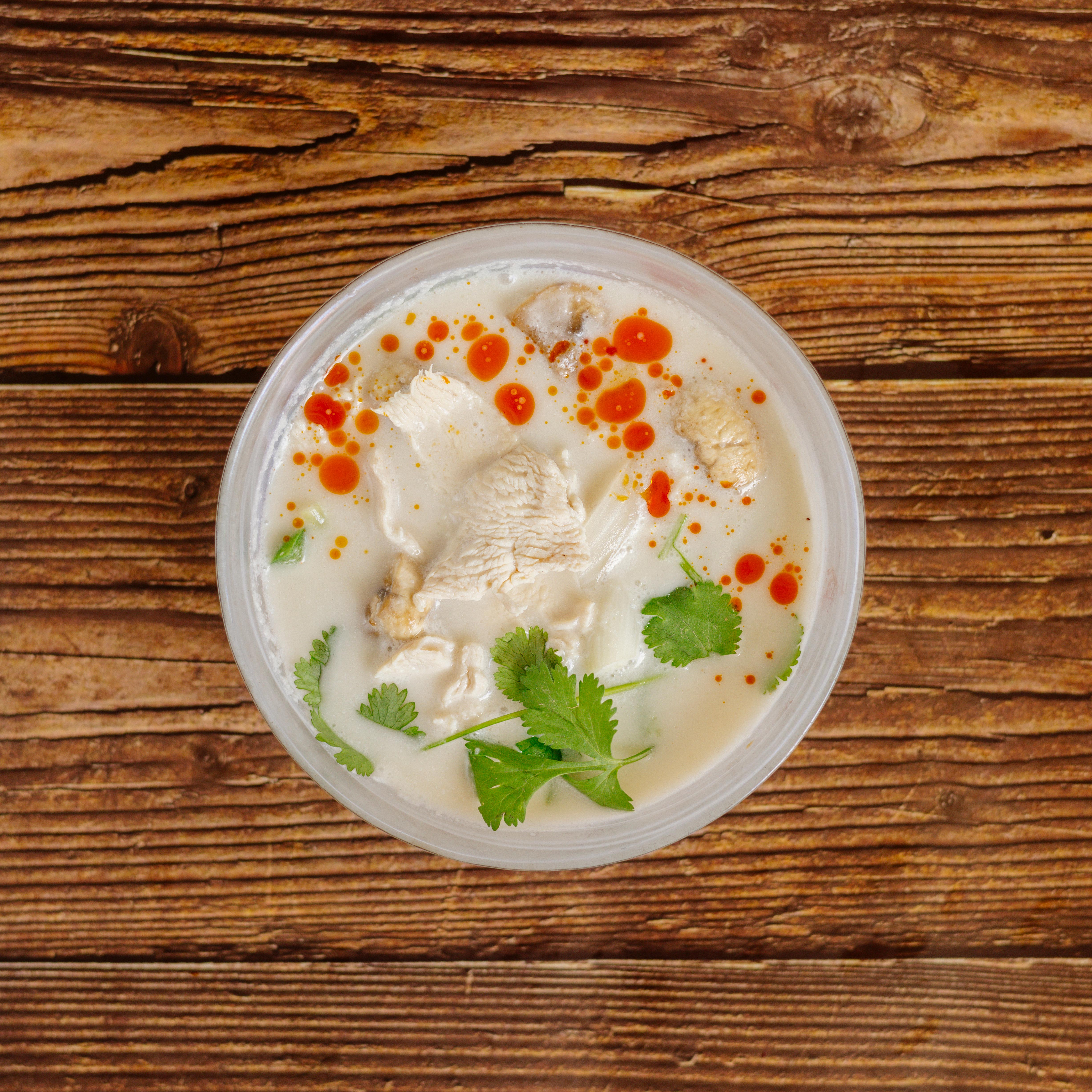 Order Tom Kha Soup food online from Herbs Thai Bistro store, New York on bringmethat.com