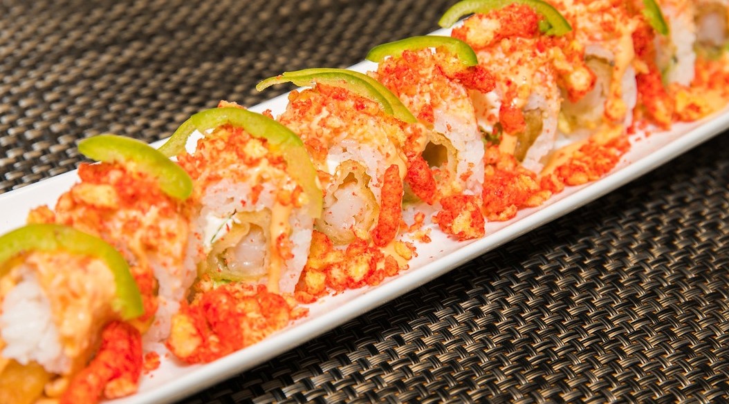 Order Flamin' Hot Cheetos Roll food online from Sushi Confidential store, Campbell on bringmethat.com