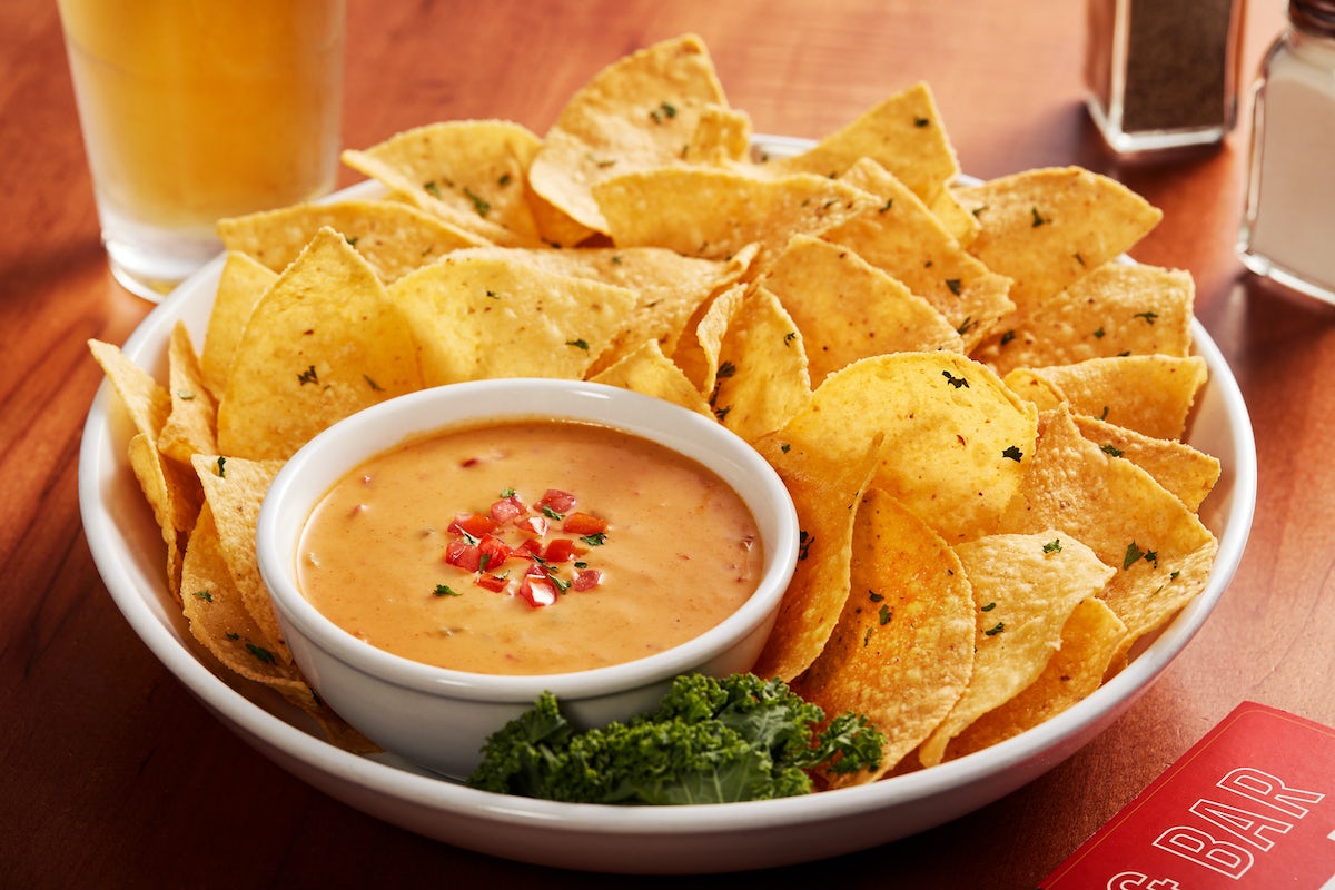 Order TRADITIONAL QUESO DIP food online from Big Whiskey's American Restaurant & Bar store, Springfield on bringmethat.com