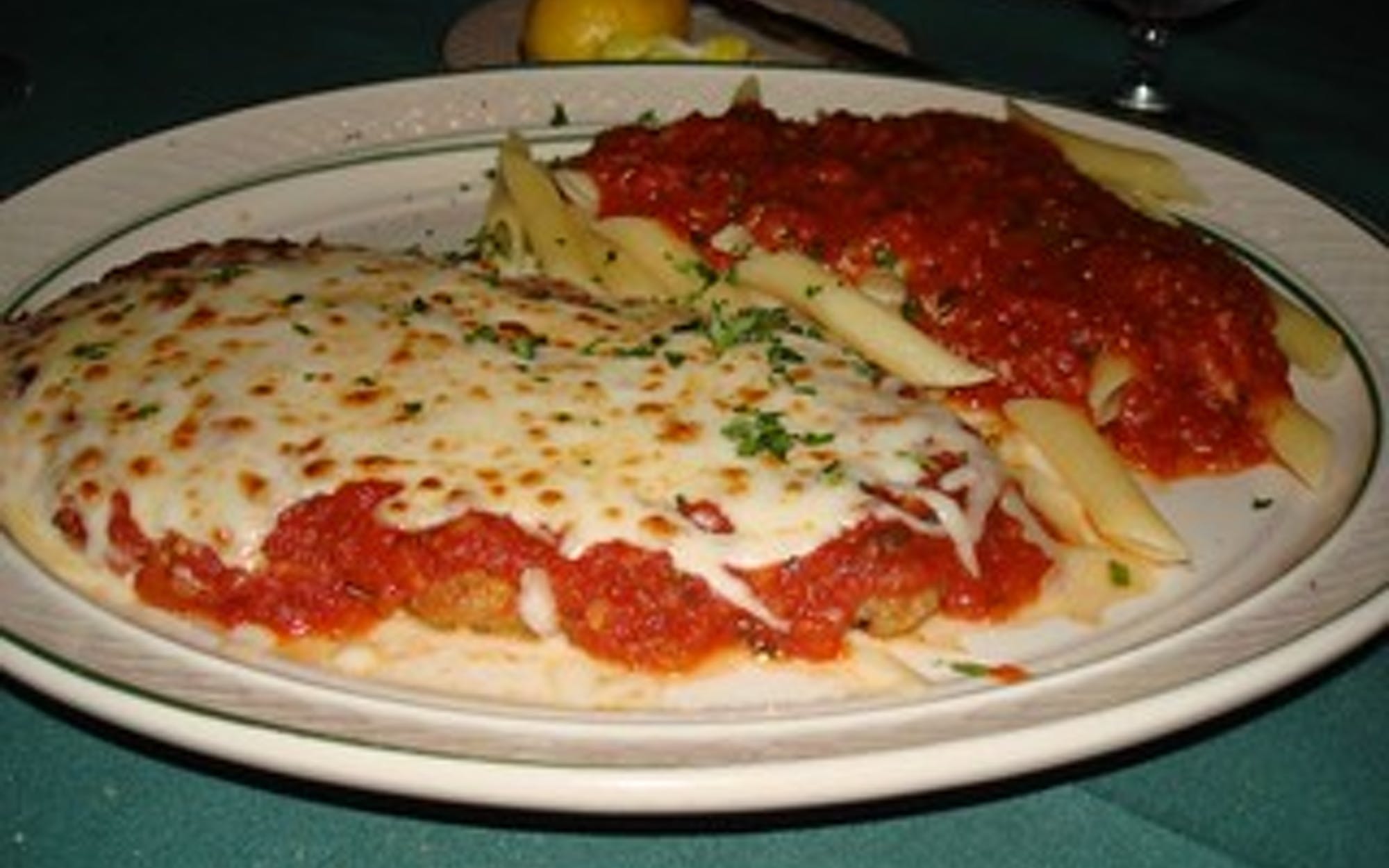 Order Veal Parmigiana - Entree food online from Pino's Pizzeria store, Easton on bringmethat.com