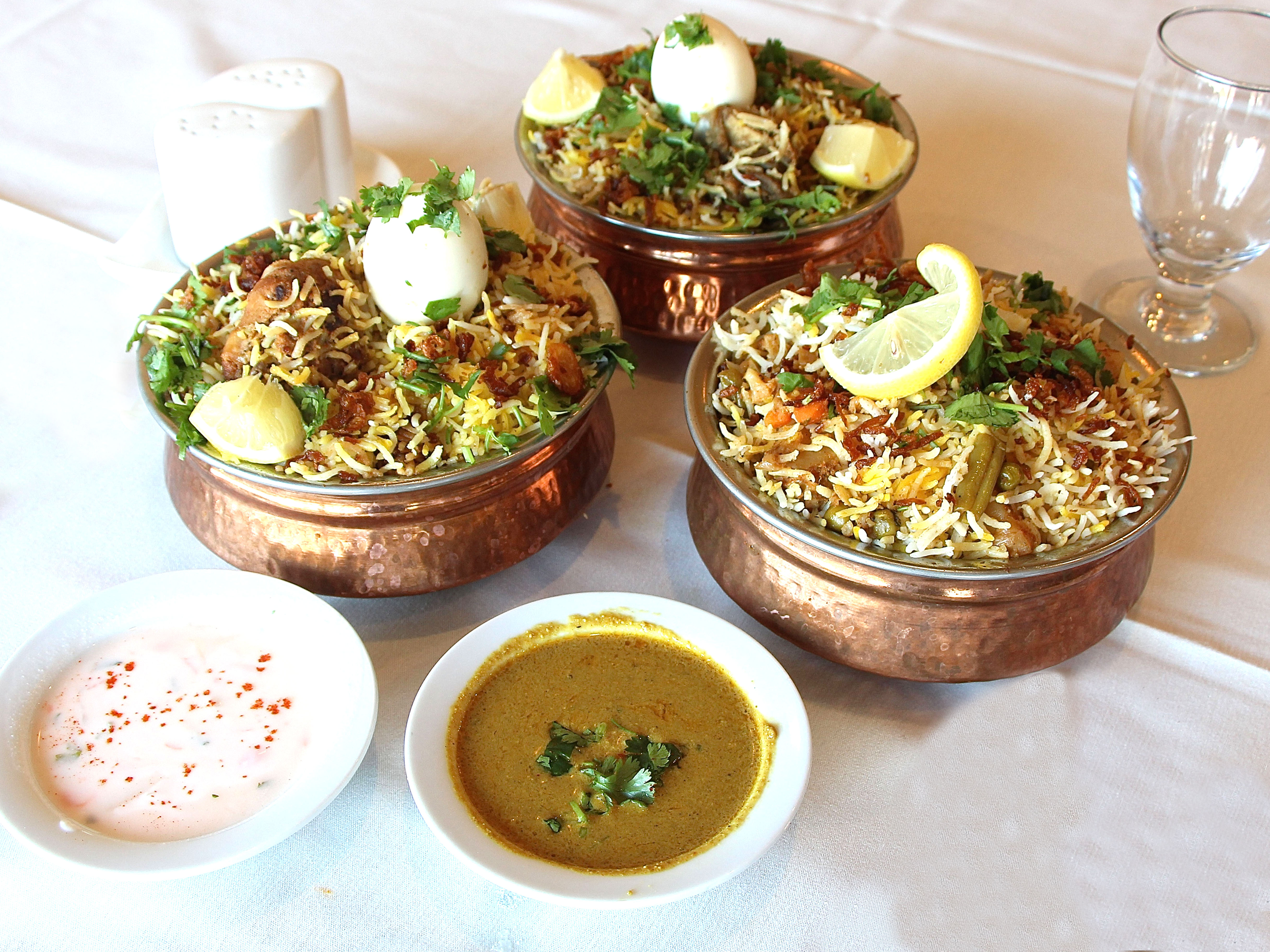 Order Hyderabadi Dum Biryani Vegetables food online from Tandoori Flames store, Parsippany on bringmethat.com