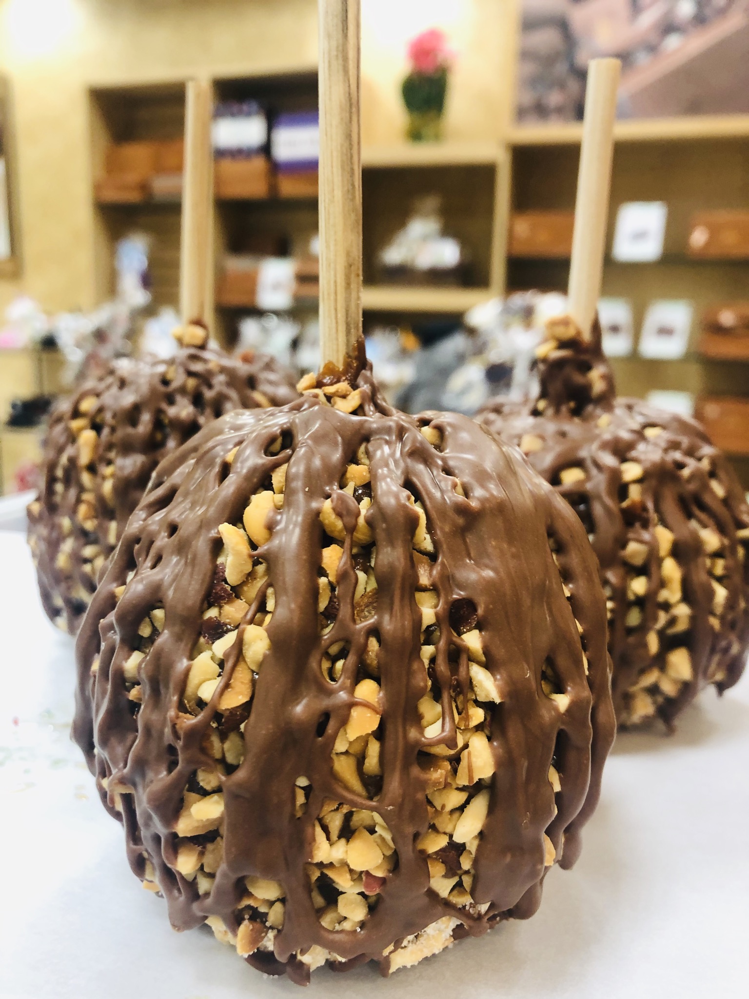 Order Peanut Caramel Apple with Milk Chocolate food online from Rocky Mountain Chocolate Factory store, Brea on bringmethat.com