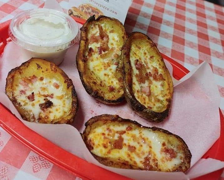 Order Loaded Potato Skins - 6 Pieces food online from North Jersey Pizza Co store, Salem on bringmethat.com