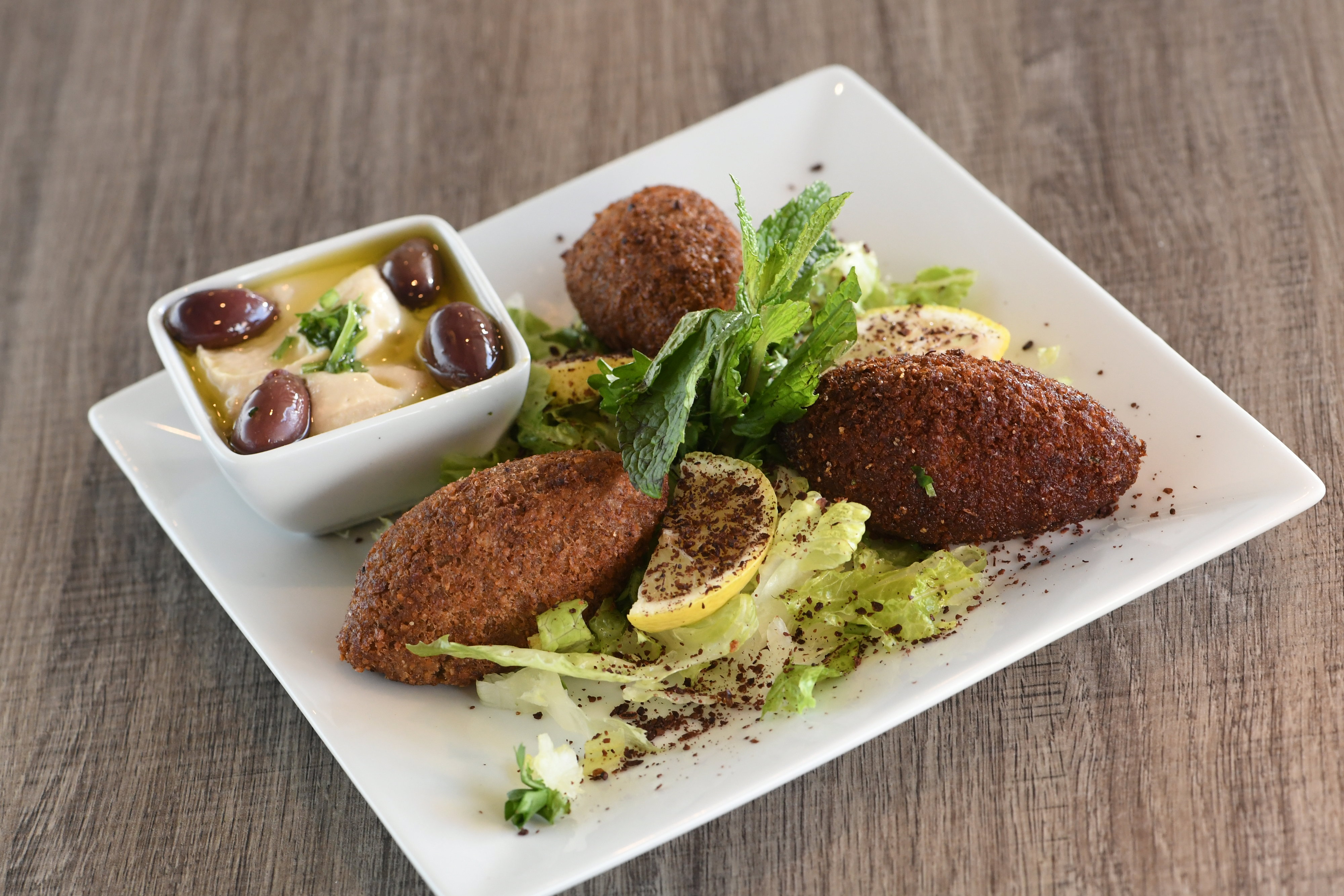 Order Kibbah food online from Shisha Cafe store, San Antonio on bringmethat.com