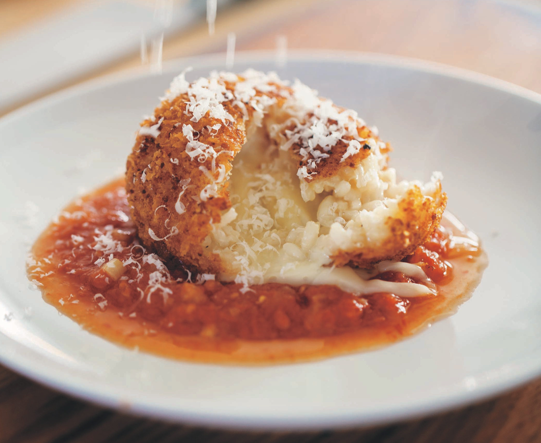 Order Arancini Rice Ball With Sauce  food online from Avellino's store, Medford on bringmethat.com