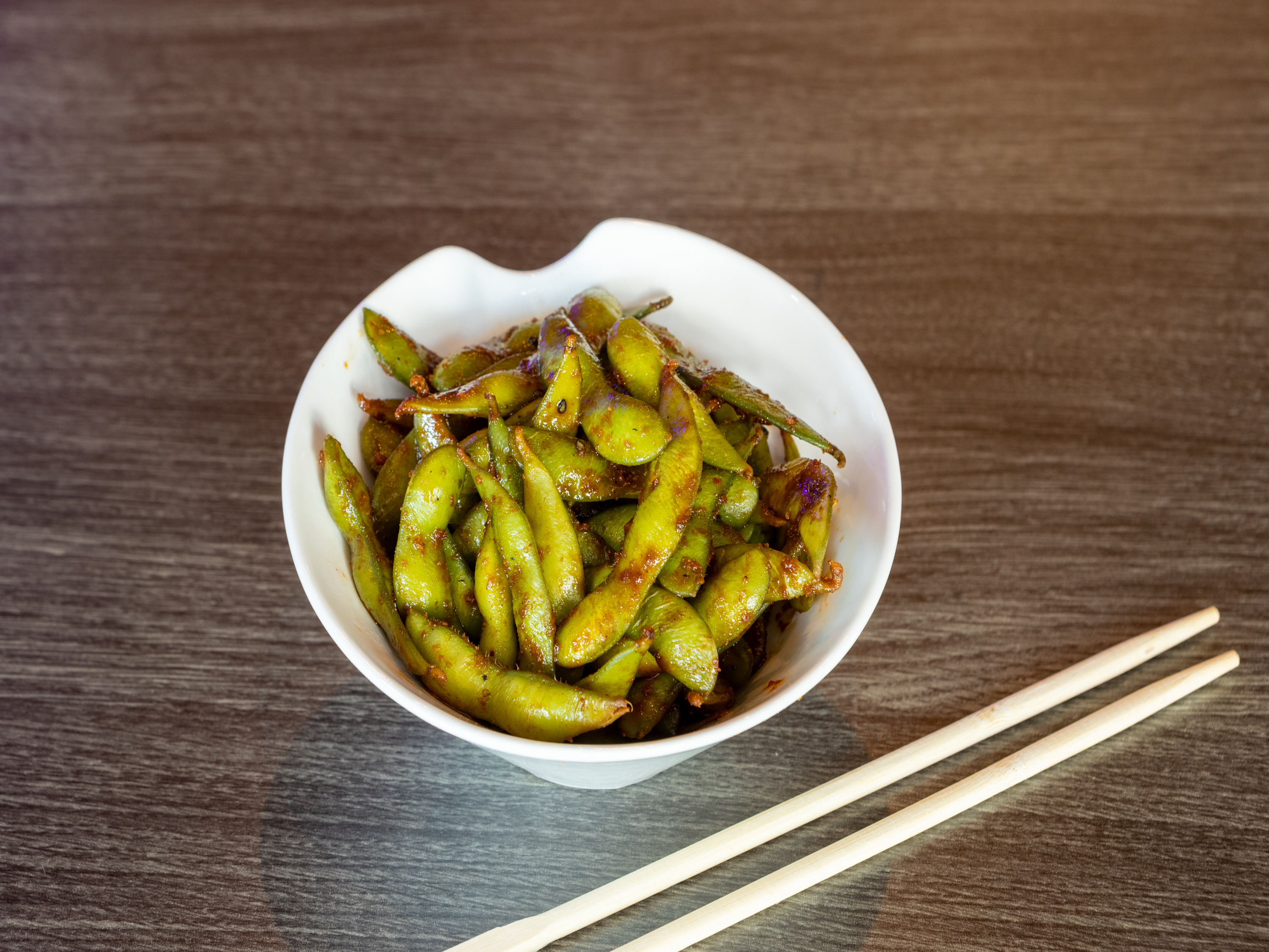 Order A3. Spicy Edamame food online from Nukumi Japanese Steak House store, Porter on bringmethat.com