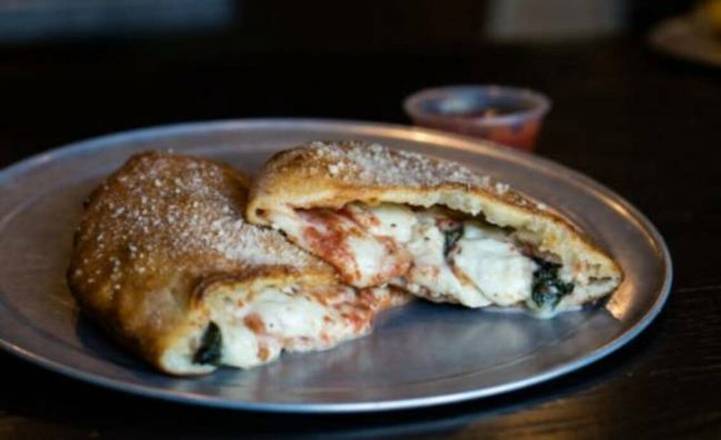 Order Groovylicious Calzone (8" Personal) food online from Peace Love & Pizza store, Marietta on bringmethat.com