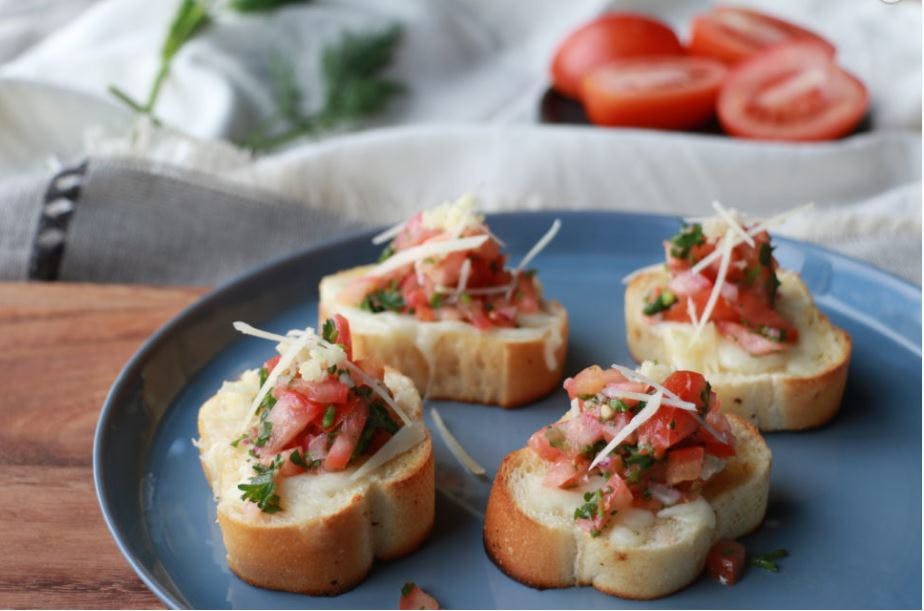 Order Classic Bruschetta - 4 Pieces food online from Pasta Roma store, Los Angeles on bringmethat.com
