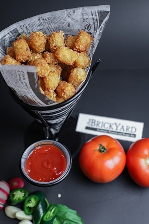 Order Basket Tater Tots food online from The Brickyard store, Woburn on bringmethat.com