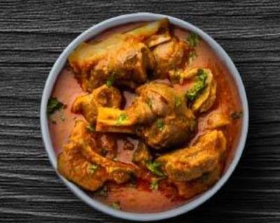 Order Homestyle Goat Curry food online from Tick-Tock Tikka House store, Upper Darby on bringmethat.com