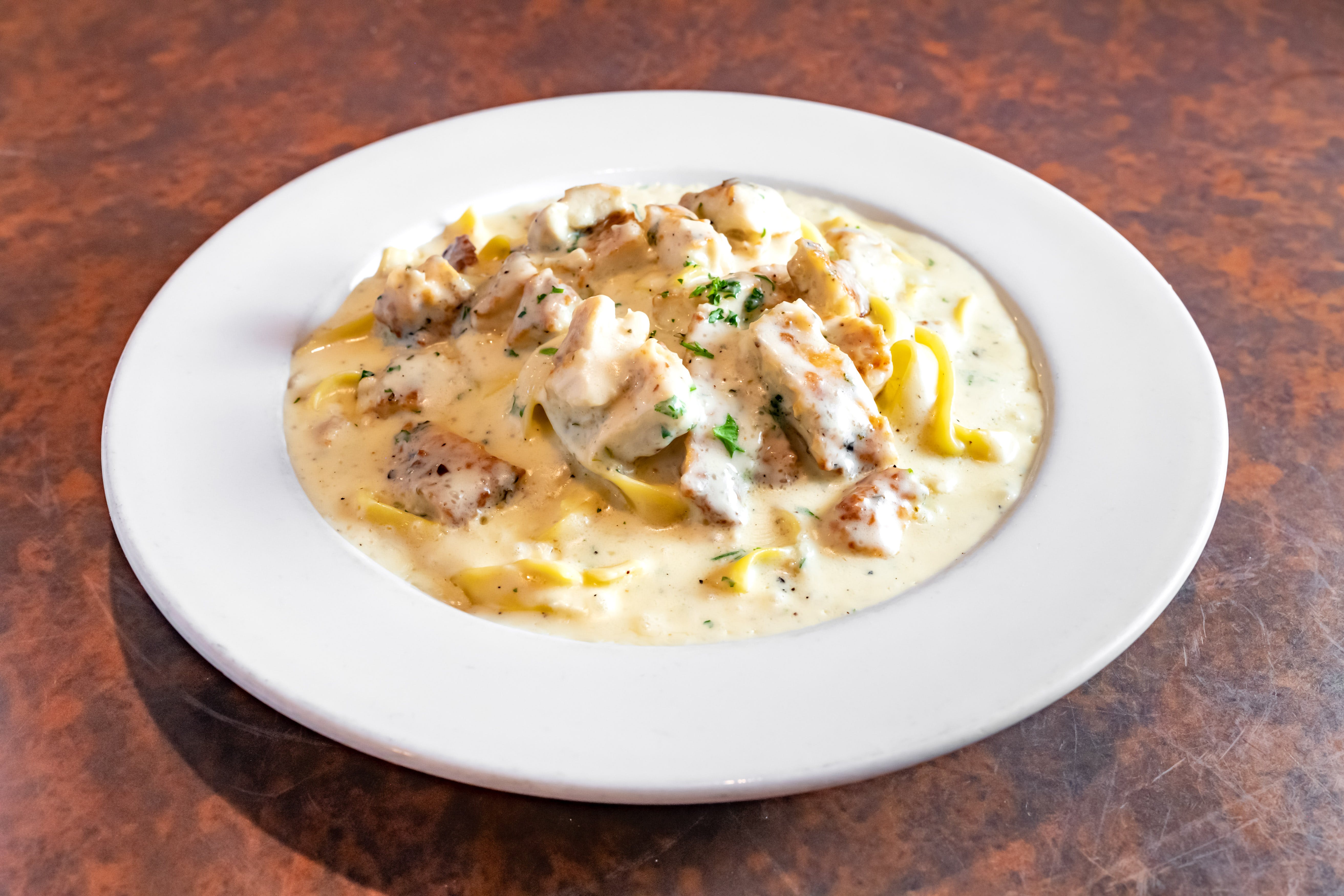Order Fettuccini Alfredo with Chicken - Entree food online from Paisano's store, Benbrook on bringmethat.com