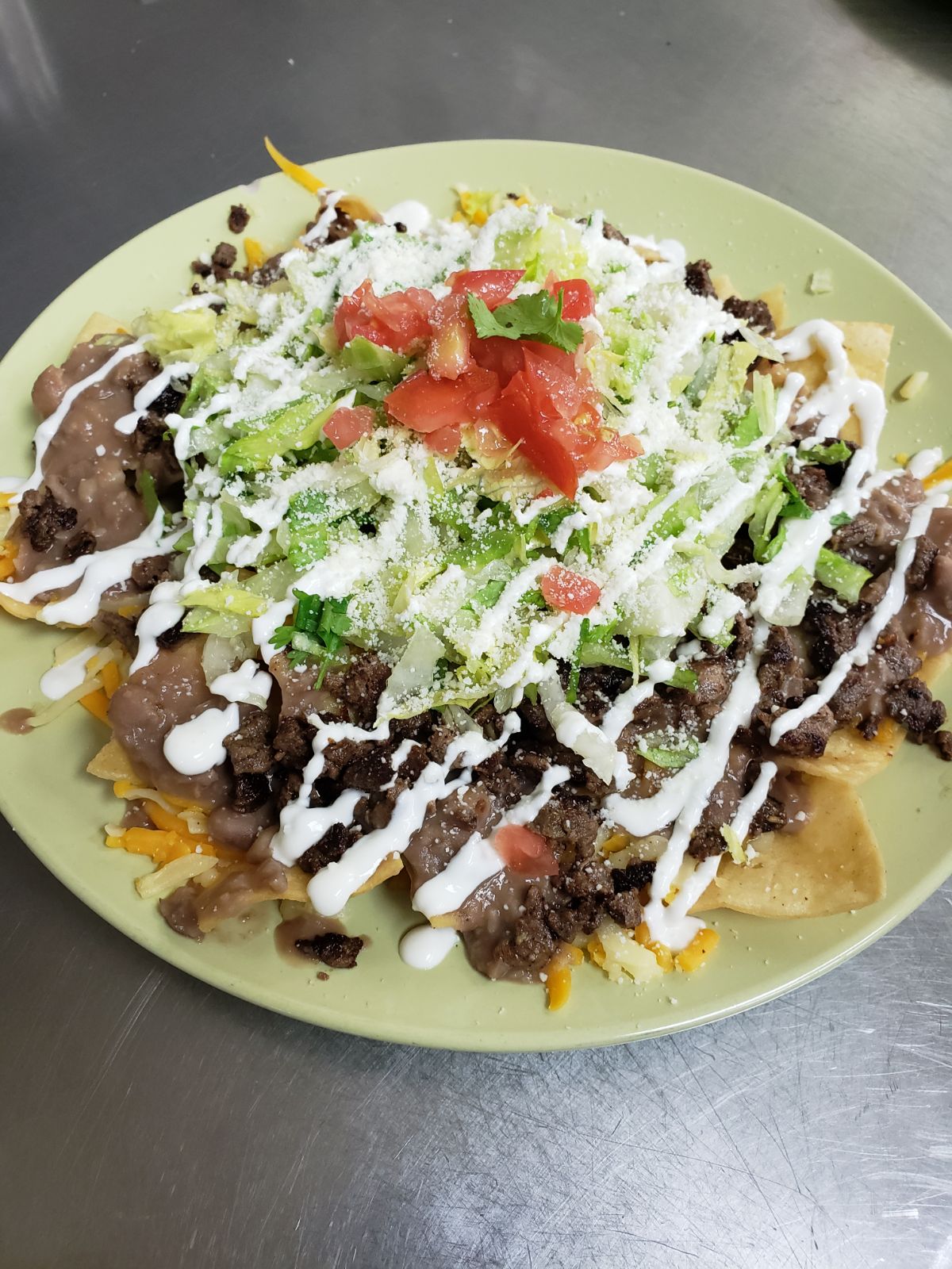Order Nachos Deluxe food online from Aminas Cafe store, Bronx on bringmethat.com