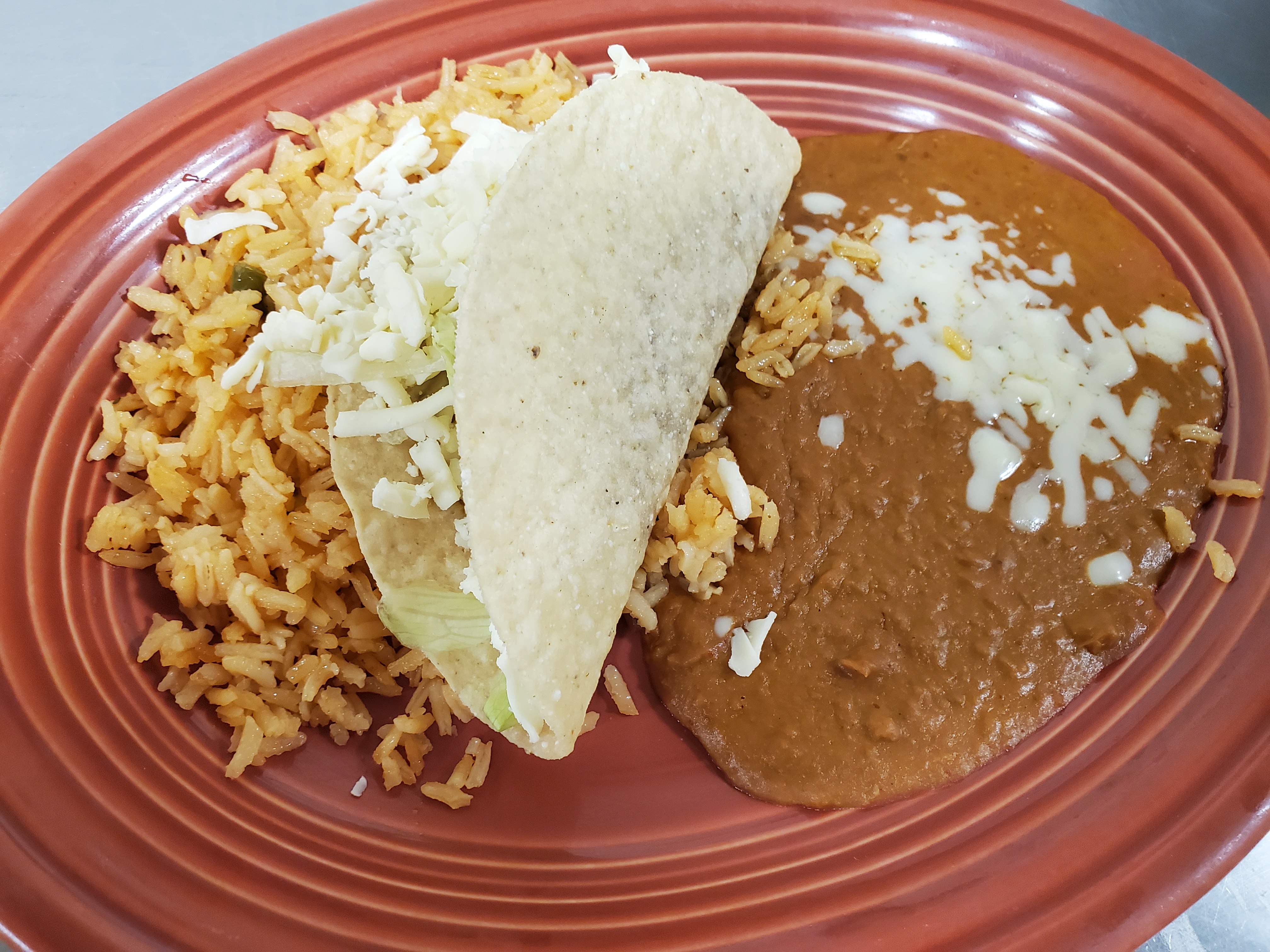Order 2. Kids 1 Beef Taco, Rice & Beans food online from Los Gallos Mexican Grill store, Rochester on bringmethat.com