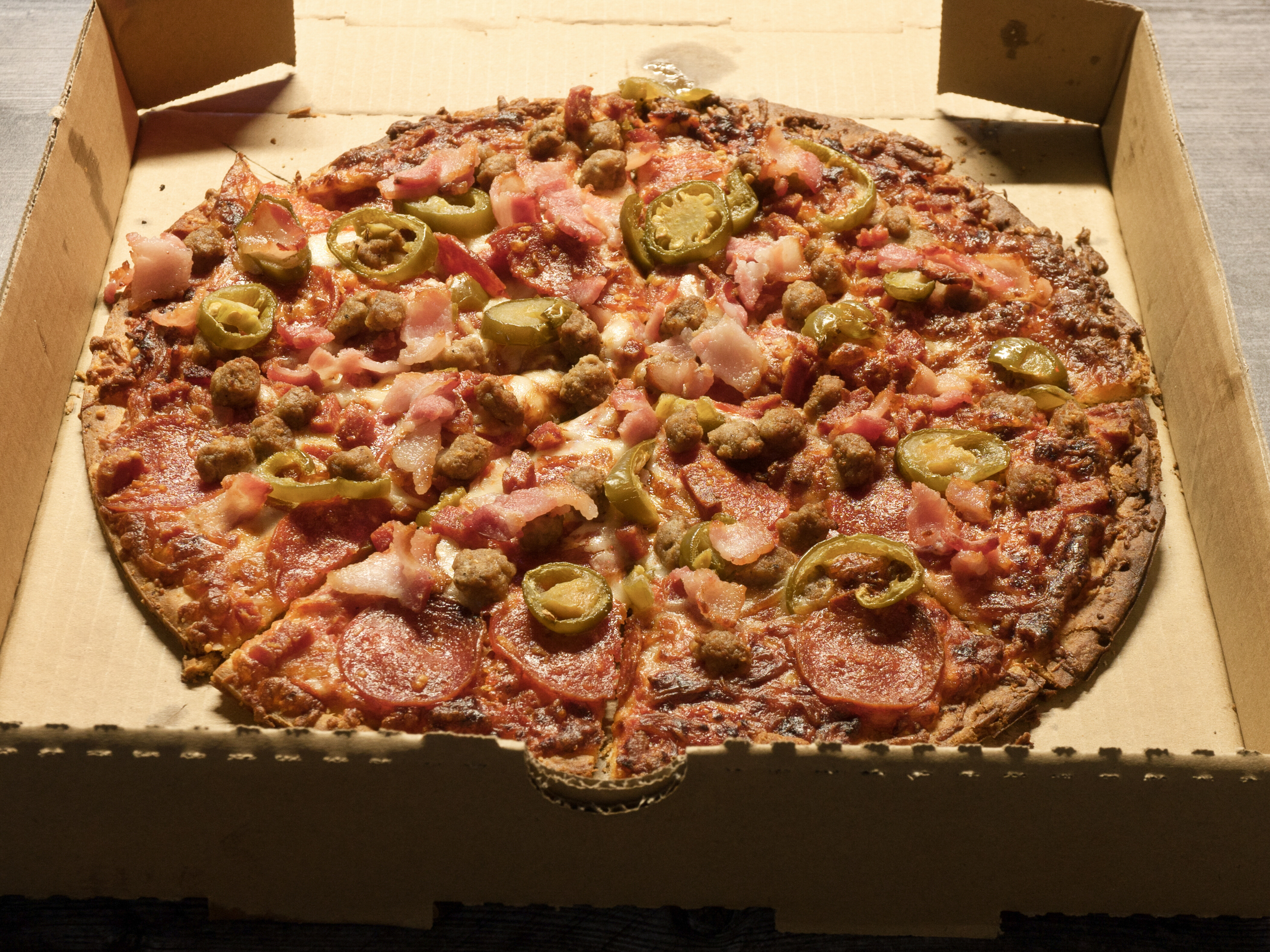 Order 12" Meat Lovers Pizza with Jalapeno food online from Papadogos store, El Paso on bringmethat.com