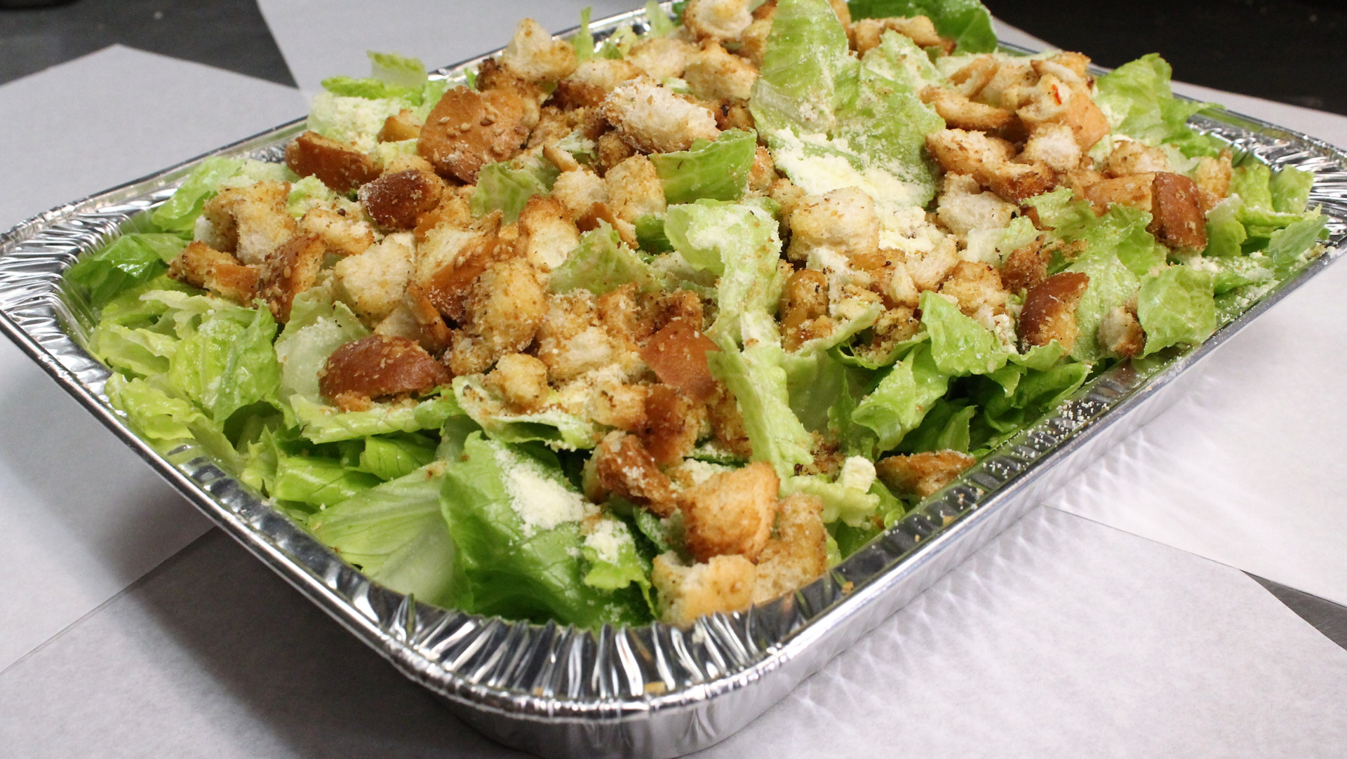 Order Tray of Caesar Salad food online from Tony Pizza & Pasta store, Oak Park on bringmethat.com