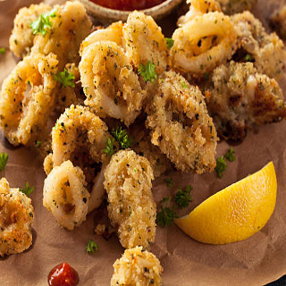 Order Fried Calamari food online from At Nine Restaurant & Bar store, New York on bringmethat.com