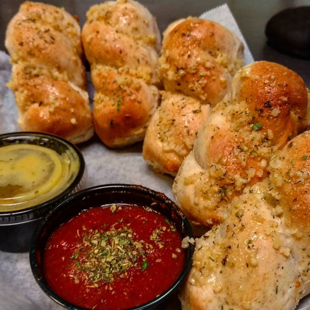 Order Garlic Twists - Appetizer food online from Holiday Pizza store, Statesboro on bringmethat.com