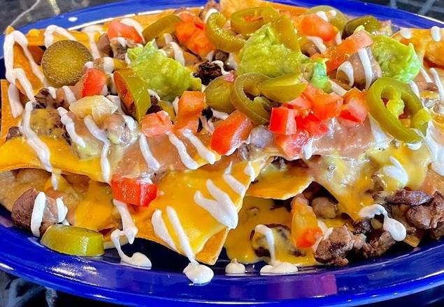 Order Nachos food online from Los Pinchis Tacos Mexican Cuisine store, Killeen on bringmethat.com