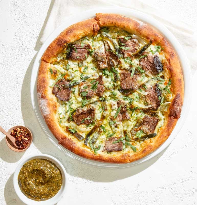 Order CARNE ASADA PIZZA food online from California Pizza Kitchen store, Hollywood on bringmethat.com