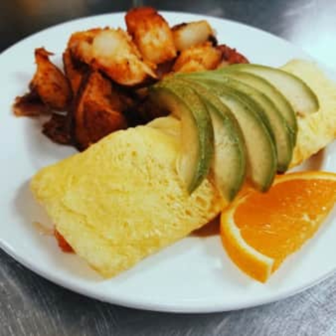 Order The Avocado Omelet food online from Famous Toastery store, Cary on bringmethat.com