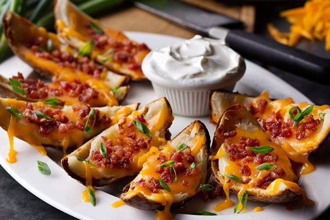 Order Made-From-Scratch Loaded Potato Skins food online from Logan Roadhouse 480 store, Norman on bringmethat.com