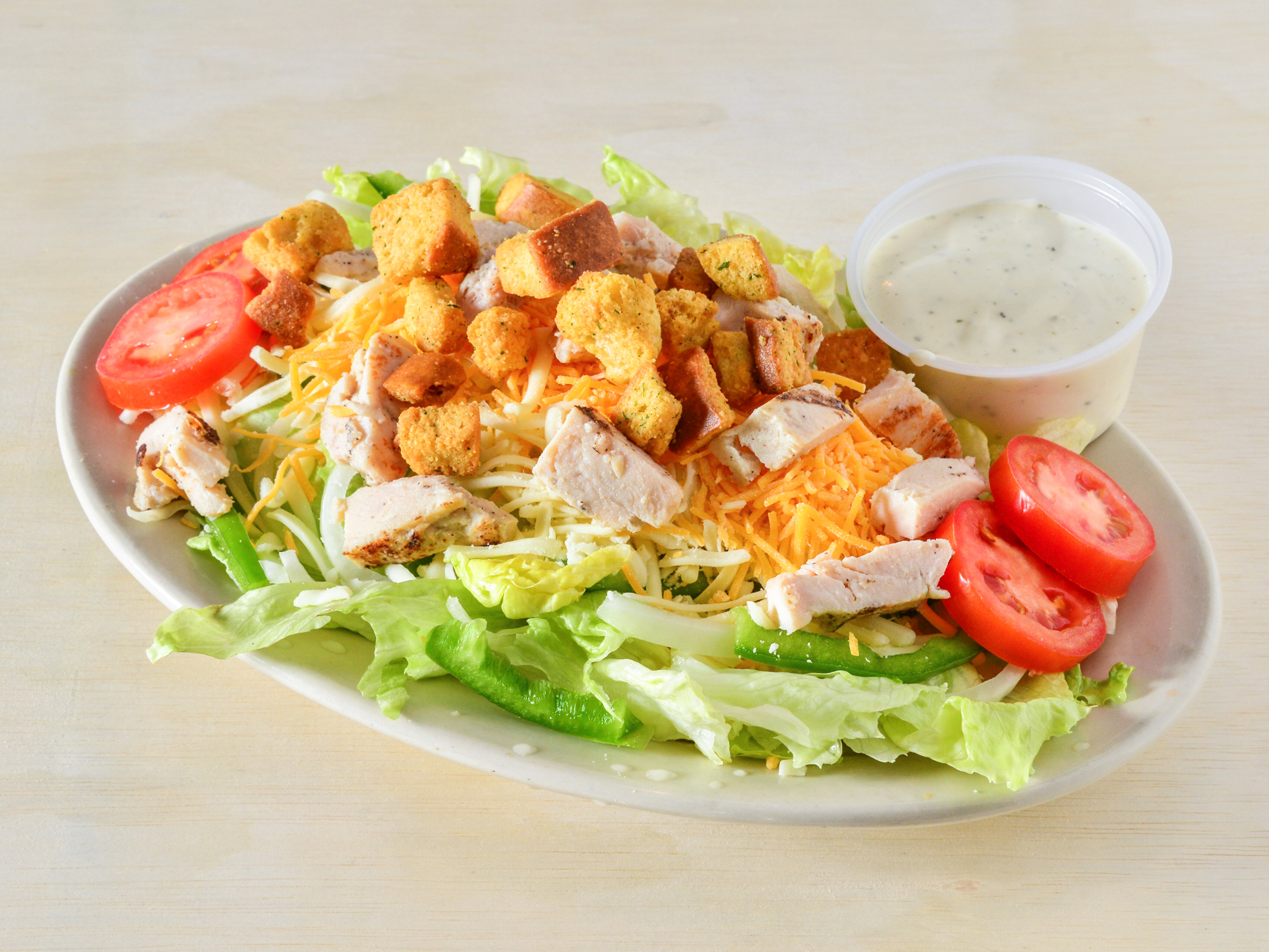 Order Grilled Chicken Salad food online from Cavoni Pizza & Grinders store, Battle Creek on bringmethat.com