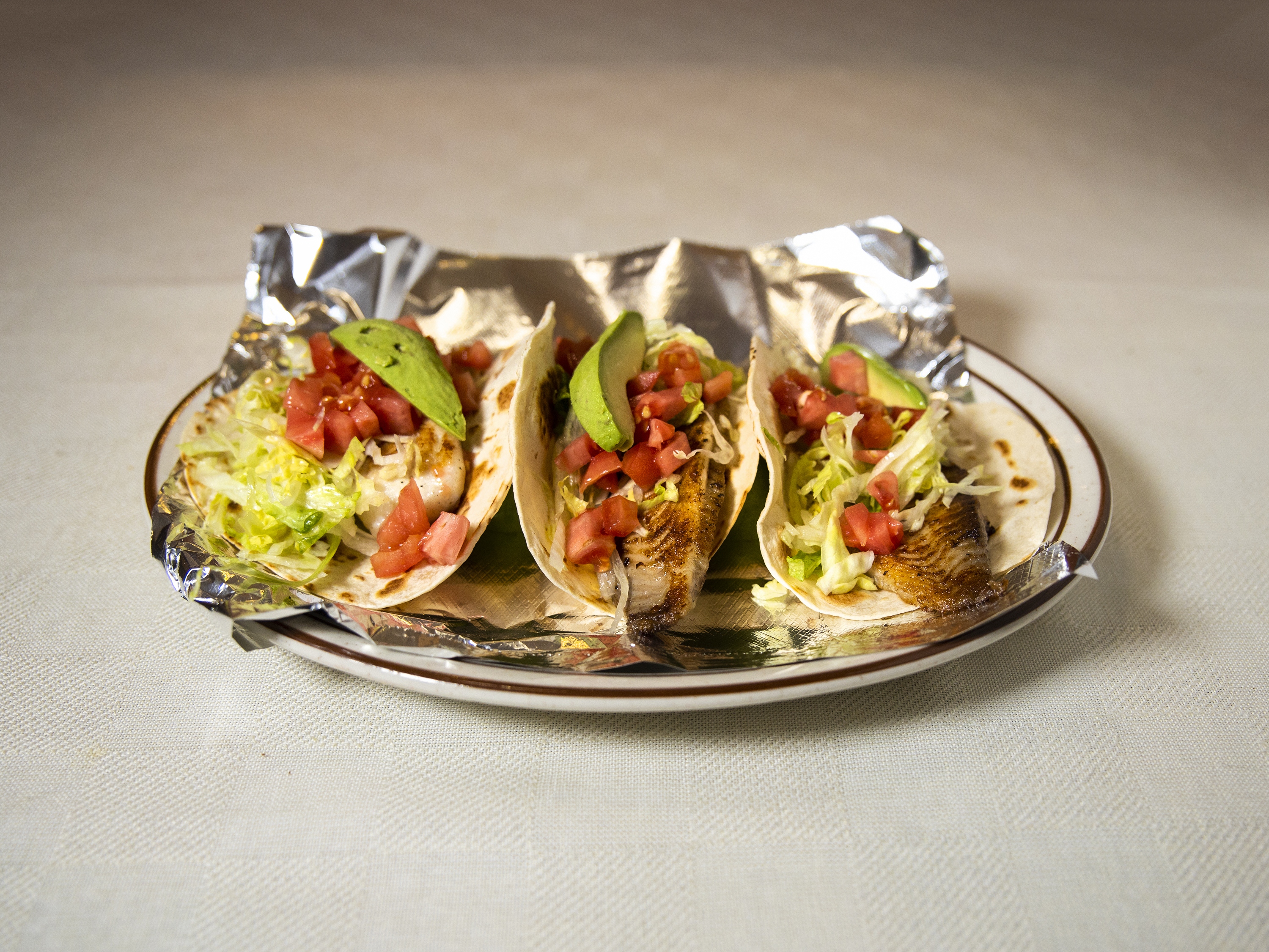 Order 100. Fish Tacos food online from El Tapatio Mexican Restaurant store, Wilmington on bringmethat.com