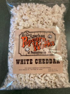 Order Gourmet White Cheddar Popcorn food online from Great American Popcorn Works store, Telford on bringmethat.com