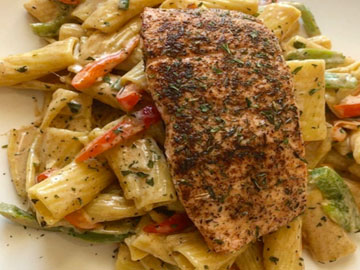 Order Rasta Pasta with Jerk Salmon food online from Tharsy Grill store, Baltimore on bringmethat.com
