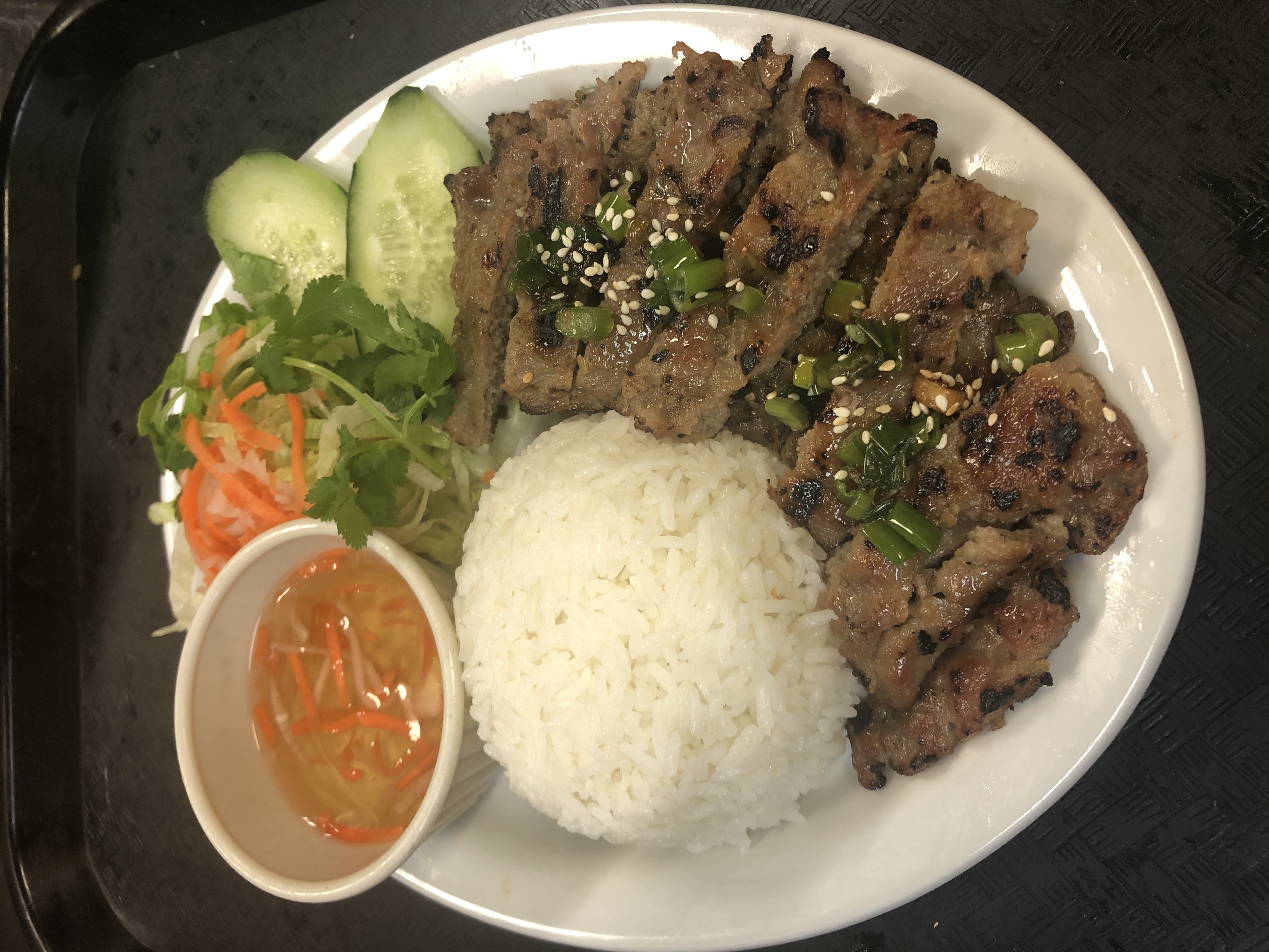 Order 44. Grilled Pork w/Steamed Rice (Cơm thịt nướng) food online from Saigon House store, San Leandro on bringmethat.com