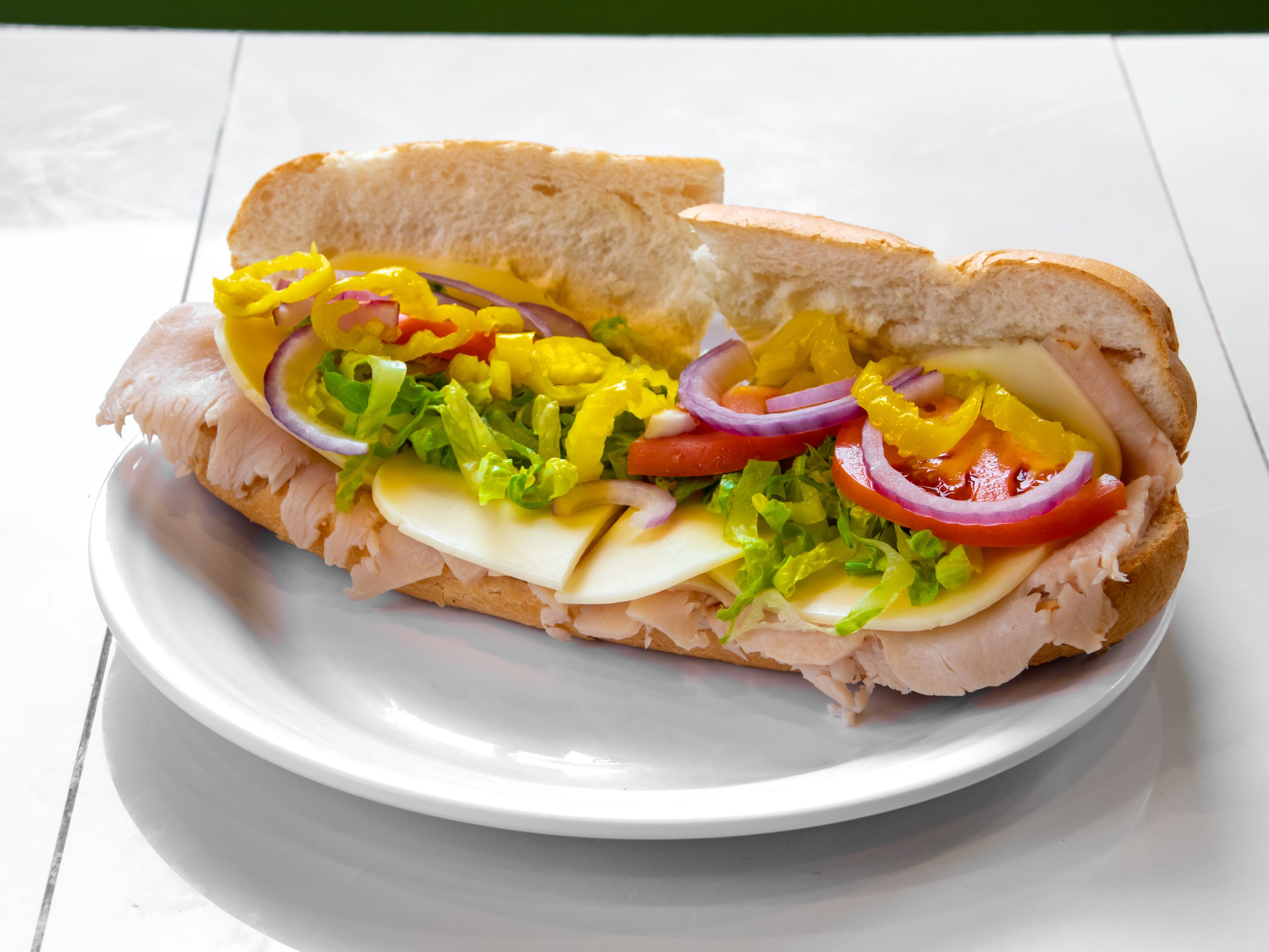 Order Turkey and Cheese Sub food online from New Yorker Pizza store, Leesburg on bringmethat.com
