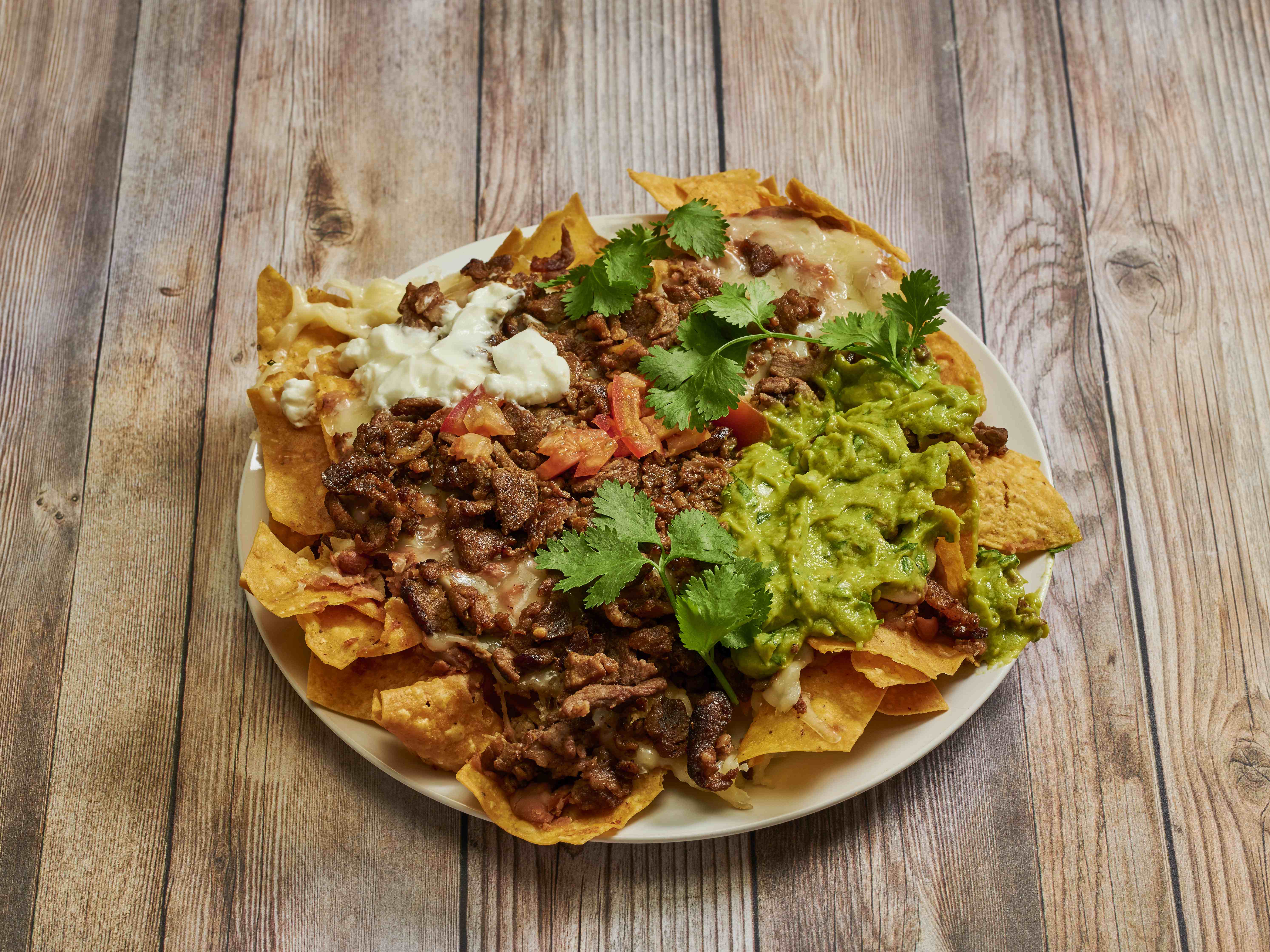 Order 3. Nachos food online from Taqueria Guerrero Style store, Westminster on bringmethat.com