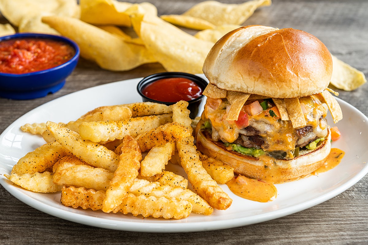 Order Loaded Queso Burger food online from On The Border store, Concord on bringmethat.com