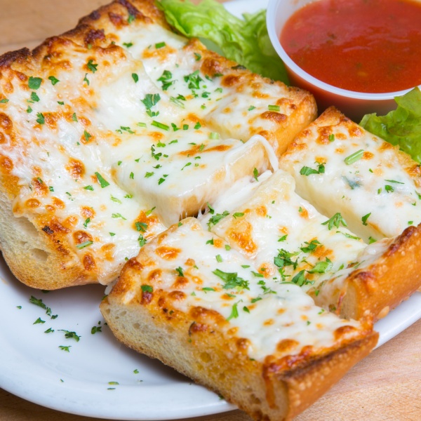 Order Garlic Cheese Bread with Marinara Sauce food online from La Vals Pizza store, Berkeley on bringmethat.com