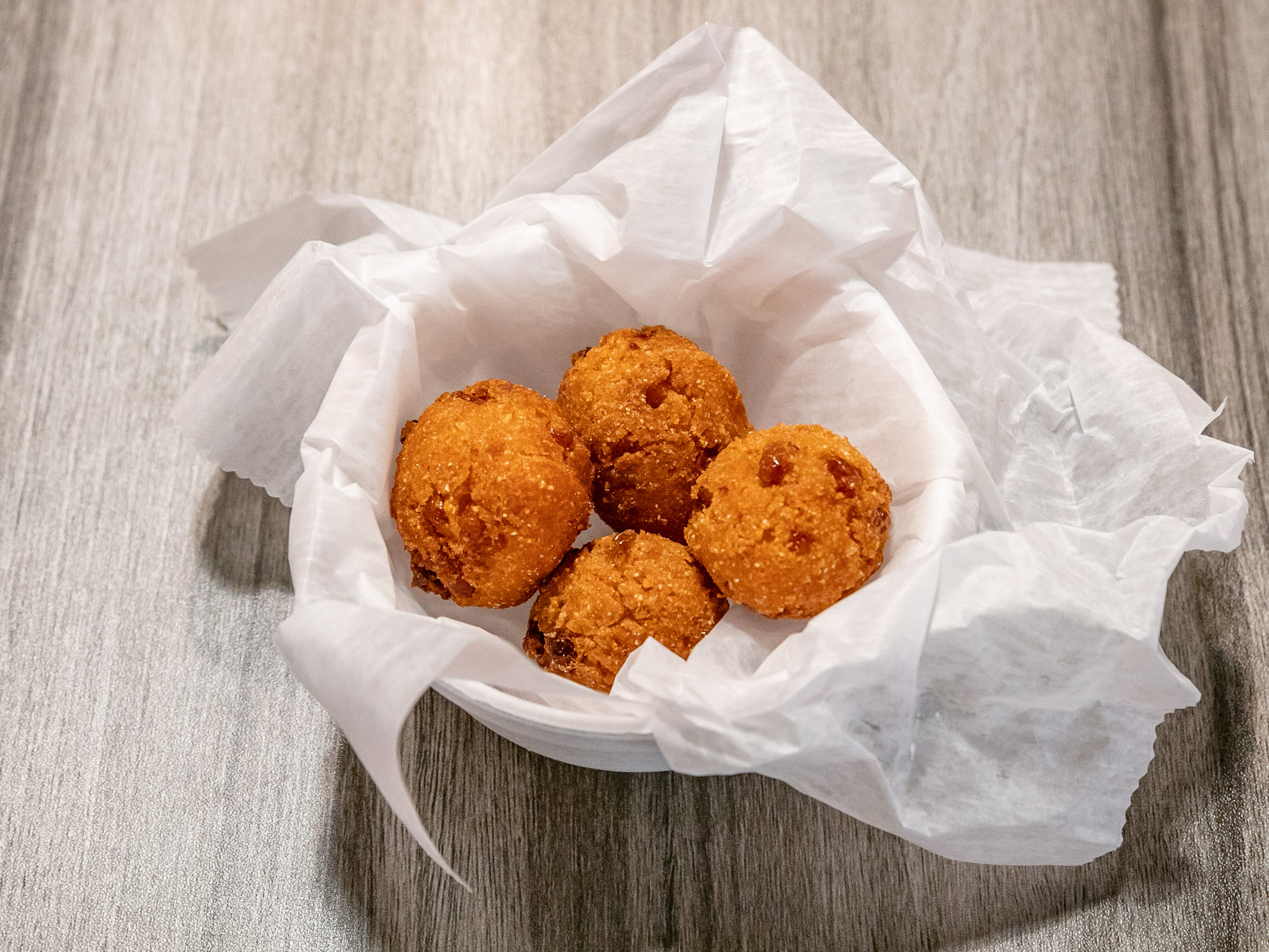 Order 6 Piece Hush Puppy food online from Top Crawfish store, Suwanee on bringmethat.com
