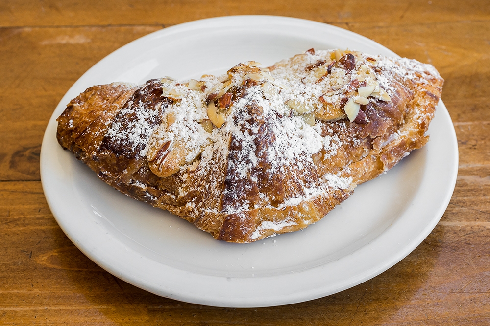 Order Almond Croissant food online from Cinderella Bakery & Cafe store, San Francisco on bringmethat.com