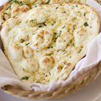 Order Garlic Naan food online from Moguls Supper Club store, Daly City on bringmethat.com